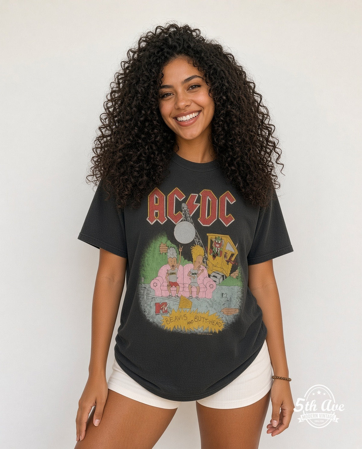 Model wearing the AC/DC x Beavis and Butt-Head Pink Couch MTV Washed vintage band t-shirt in black