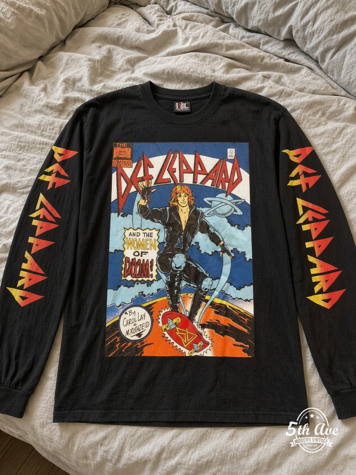 ETS LS 22 Def Leppard Women of Doom Comic long sleeve vintage tee laid on a bed