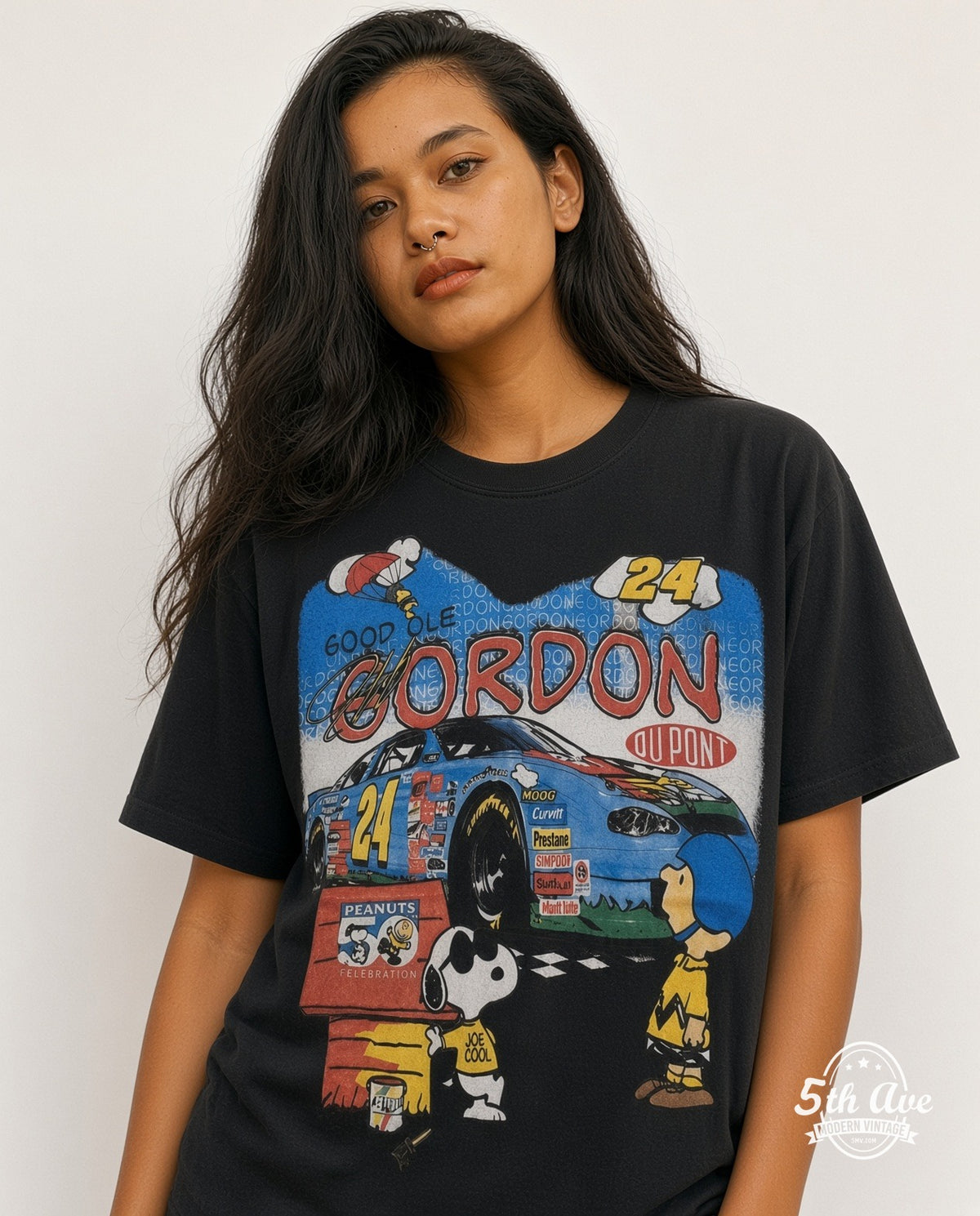 Model wearing the NASCAR Jeff Gordon #24 Good Ol Gordon Peanuts Snoopy all-over-print vintage graphic t-shirt in black