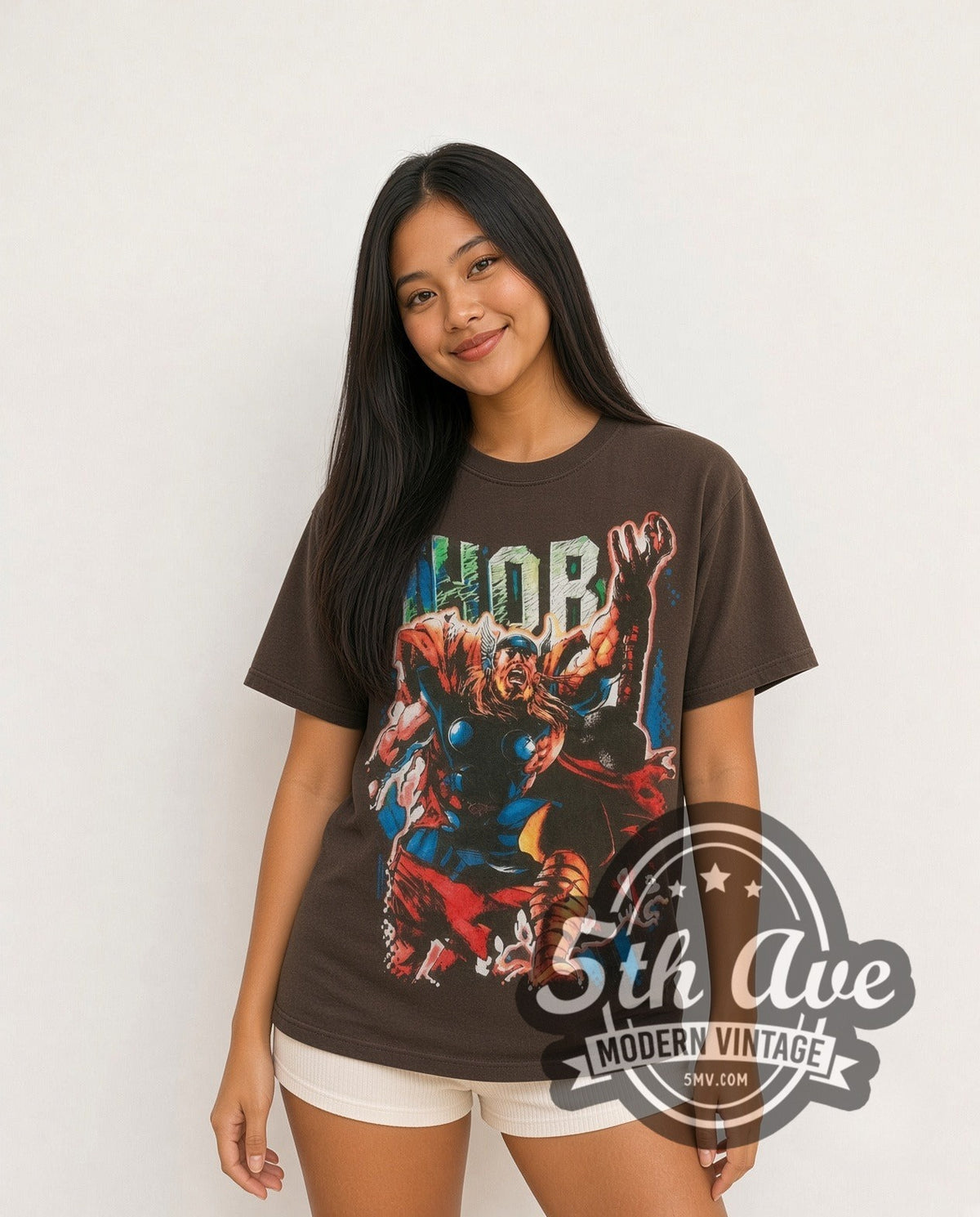 Model wearing the Marvel Thor Comic Action all-over-print vintage cartoon t-shirt in brown