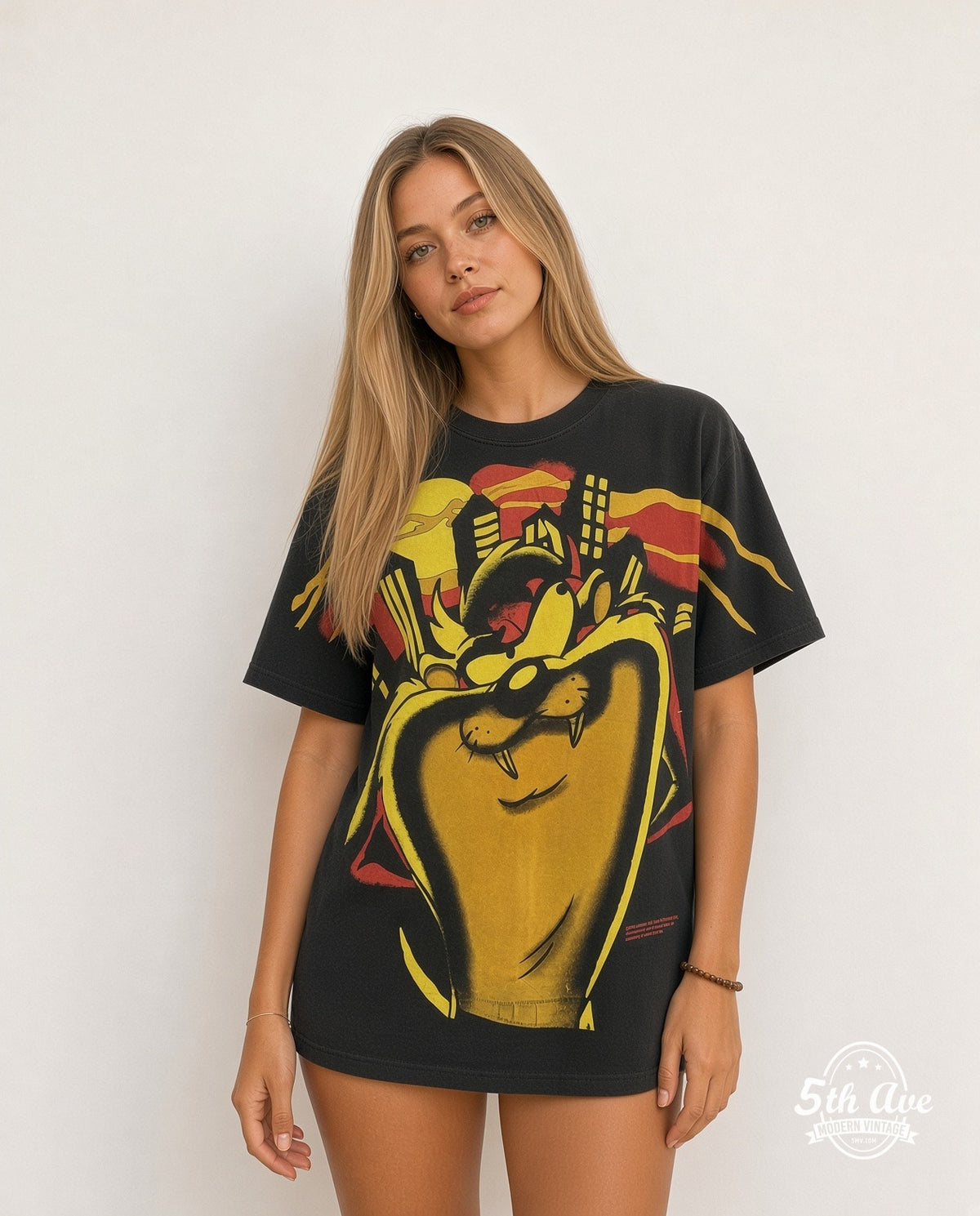 Model wearing Looney Tunes Taz Giant Face Yellow vintage cartoon tee