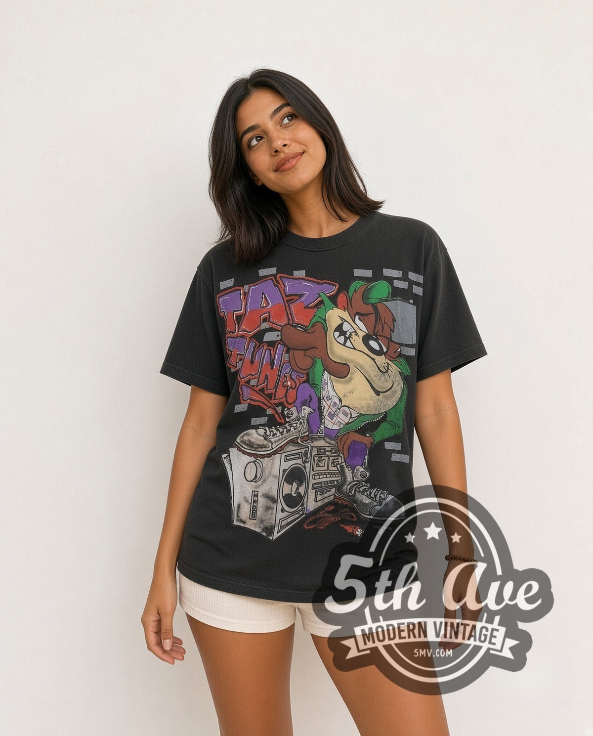 Model wearing the Looney Tunes Taz Funk Boombox all-over-print vintage cartoon t-shirt in black