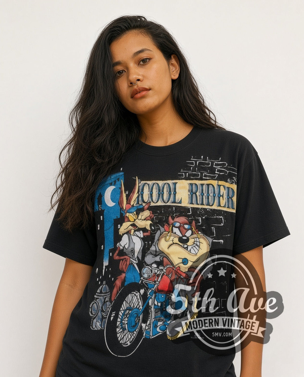 Model wearing the Looney Tunes Cool Riders Taz & Wile E all-over-print vintage cartoon t-shirt in black