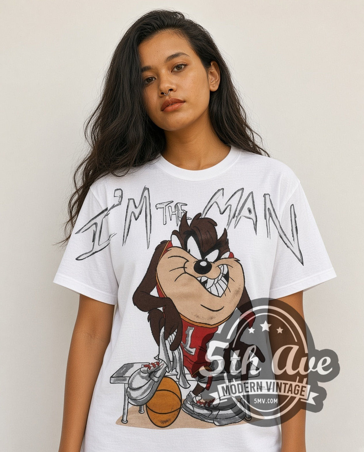Model wearing the Looney Tunes Taz I'm The Man Basketball all-over-print vintage cartoon t-shirt in white