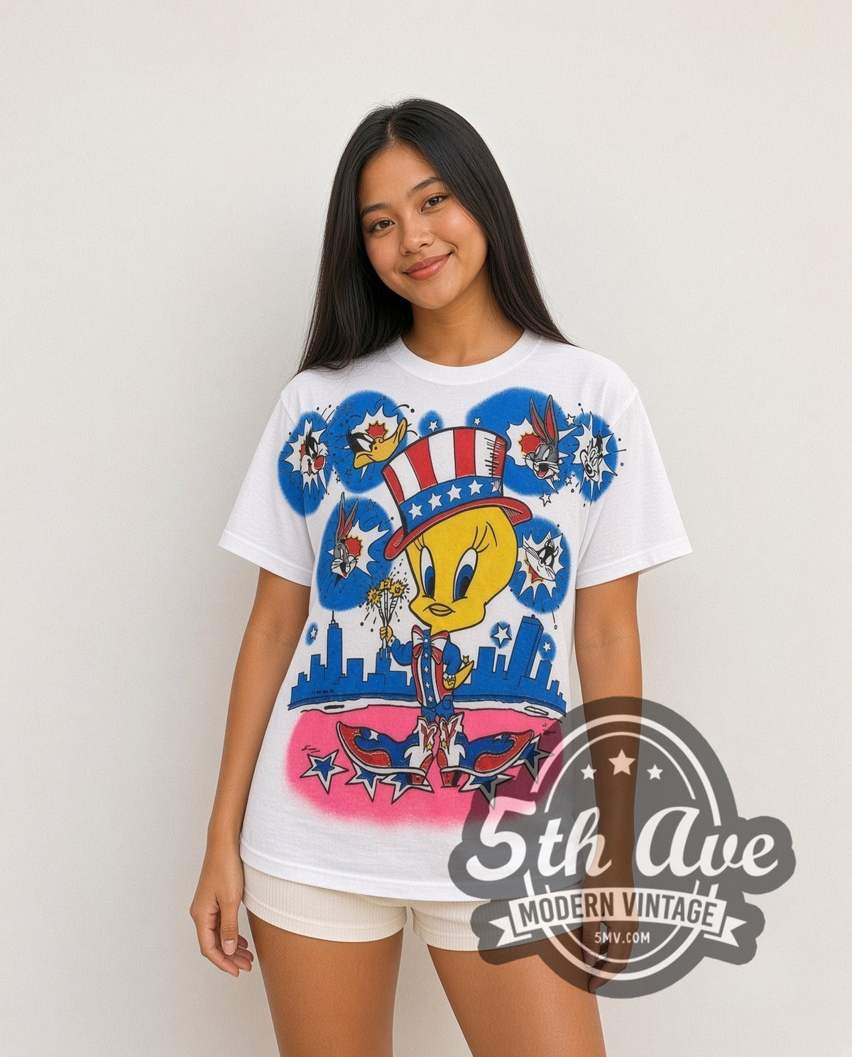 Model wearing the Looney Tunes Tweety Uncle Sam Patriotic all-over-print vintage cartoon t-shirt in white