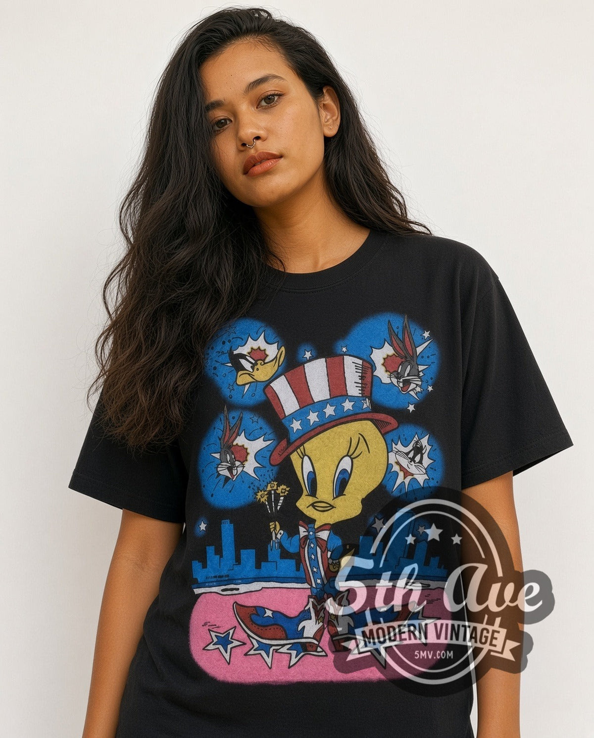 Model wearing the Looney Tunes Tweety Uncle Sam Patriotic all-over-print vintage cartoon t-shirt in black