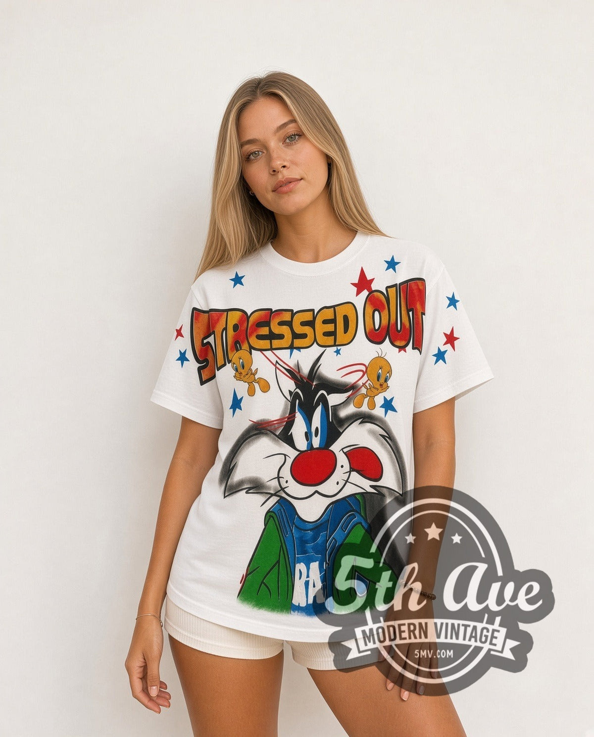 Model wearing the Looney Tunes Sylvester & Tweety Stressed Out all-over-print vintage cartoon t-shirt in white