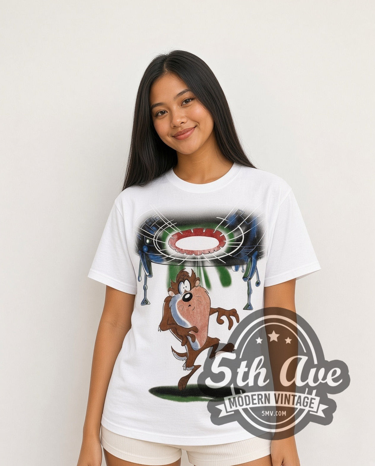 Model wearing the Looney Tunes Taz UFO Abduction all-over-print vintage cartoon t-shirt in white