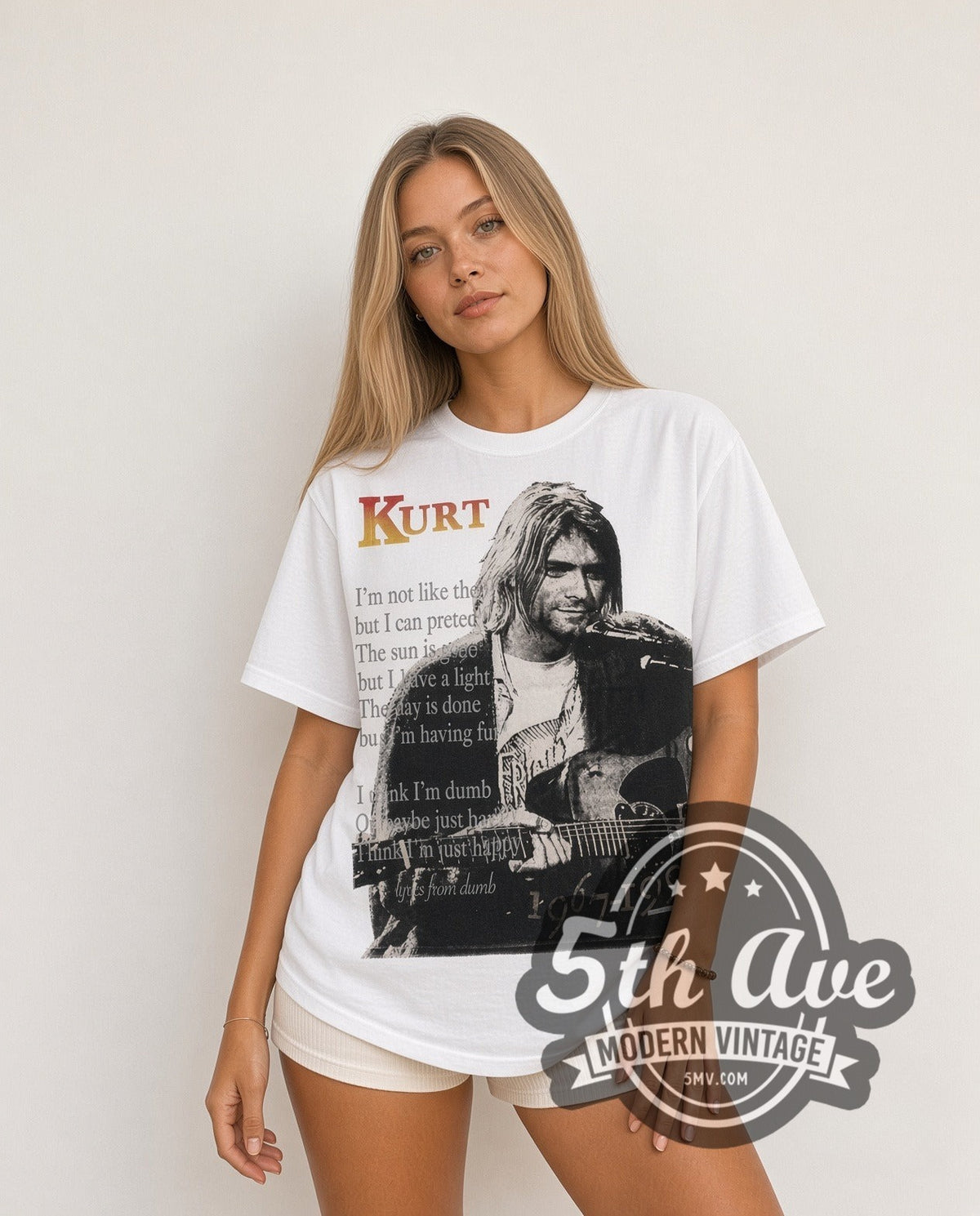 Model wearing the Kurt Cobain 1967-1994 Live At Last all-over-print vintage band tee in white