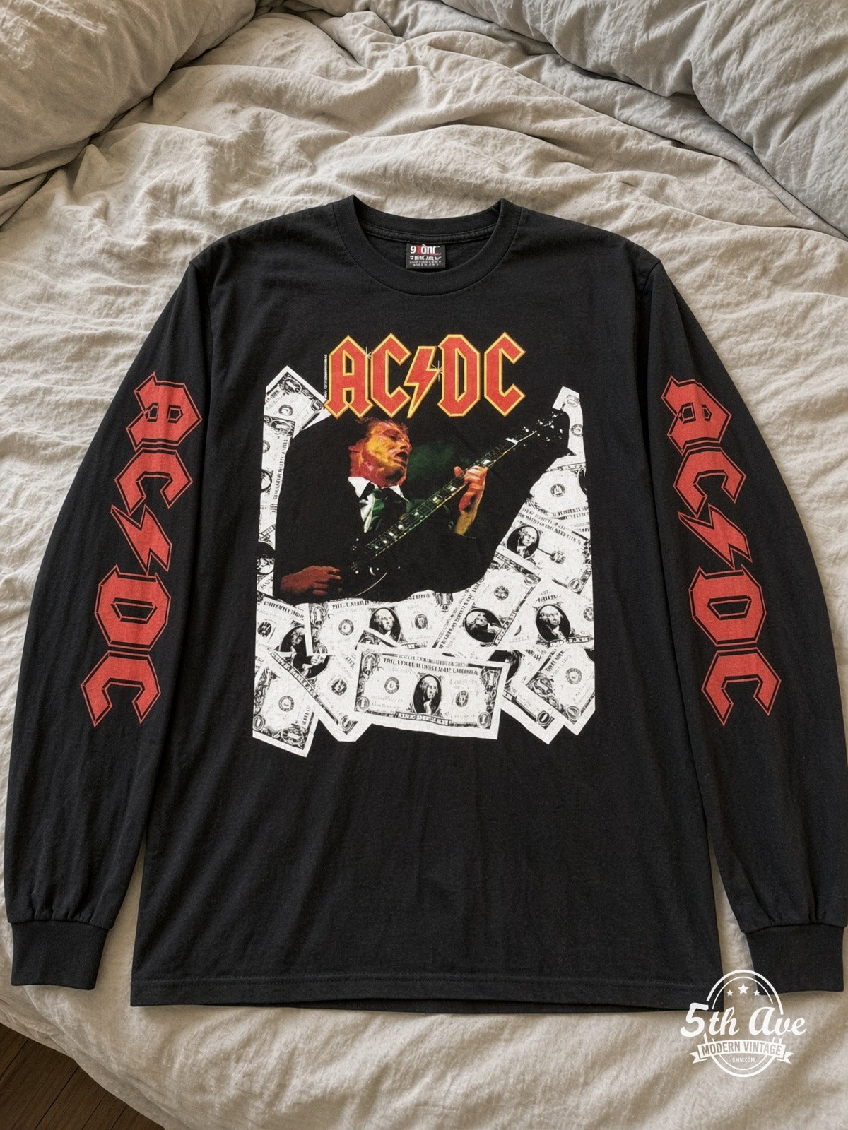 ETS LS 30 AC/DC Angus Money long sleeve vintage tee laid on a bed