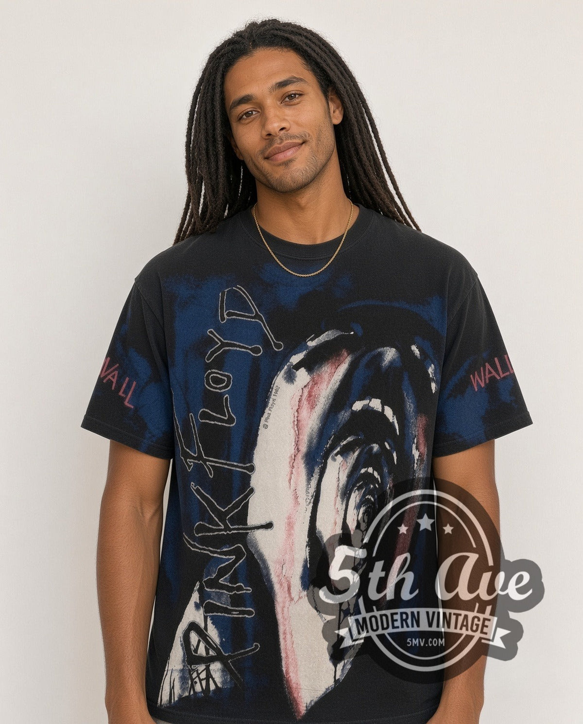 Model wearing the Pink Floyd The Wall Scream all-over-print vintage band t-shirt in black