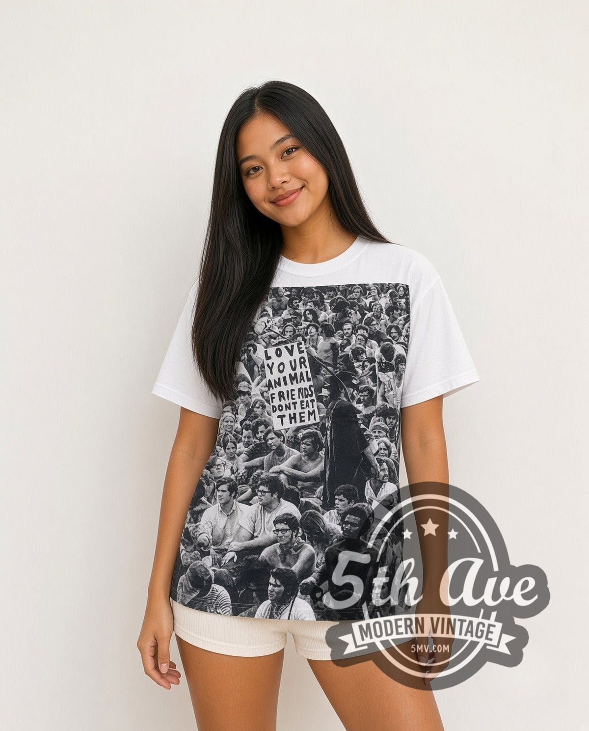 Model wearing the Love Your Animals Dont Eat Them Crowd all-over-print vintage graphic tee in white