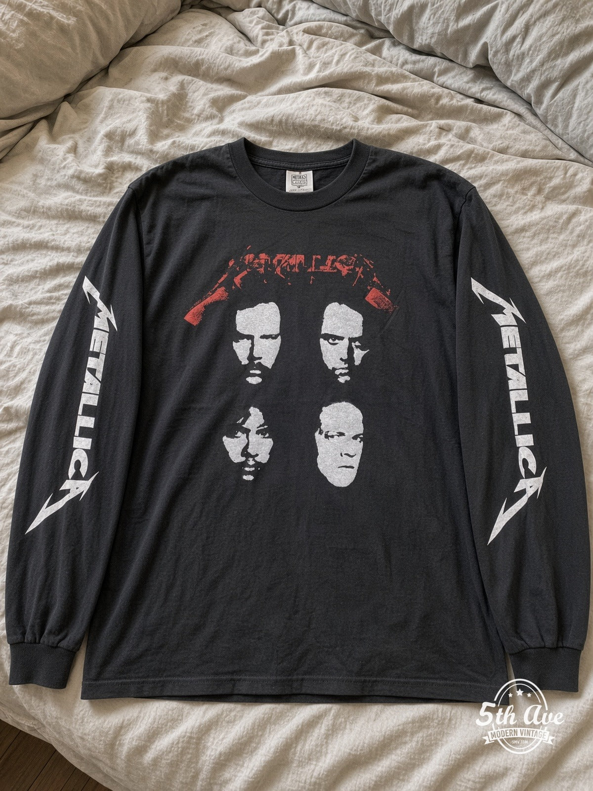 ETS LS 49 Metallica Four Faces long sleeve vintage tee laid on a bed