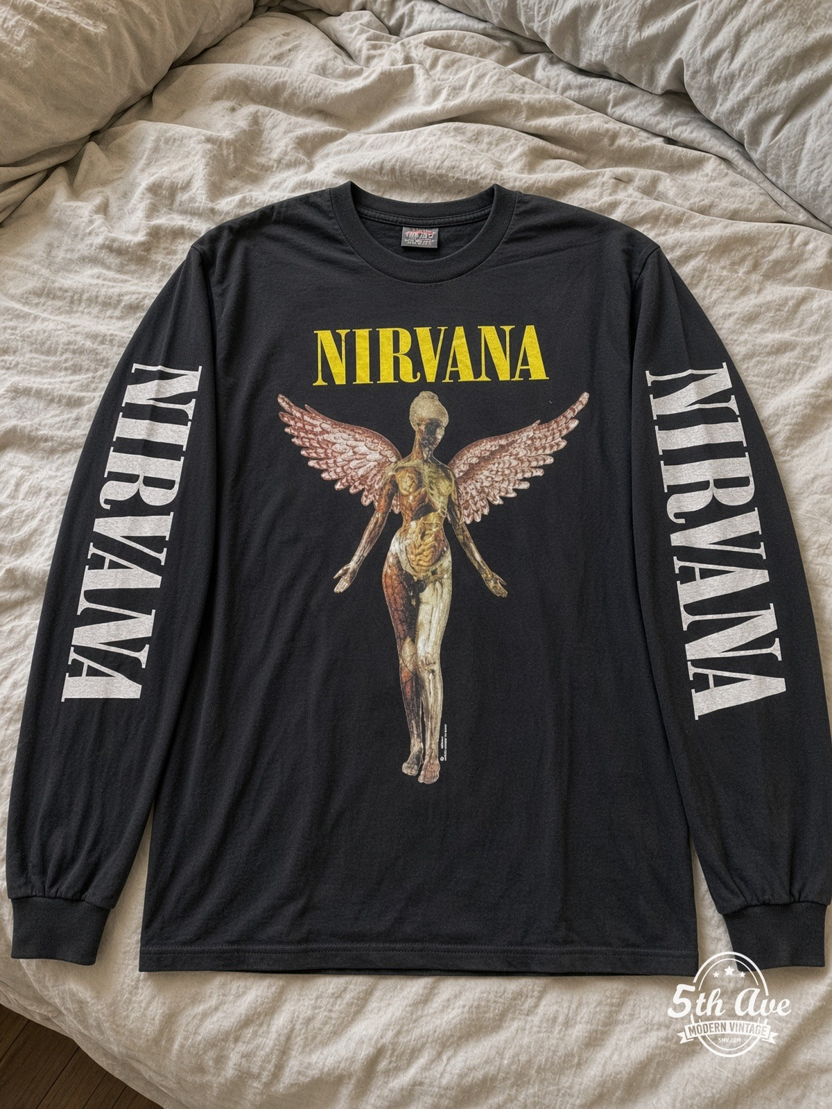 ETS LS 52 Nirvana In Utero Angel long sleeve vintage tee laid on a bed