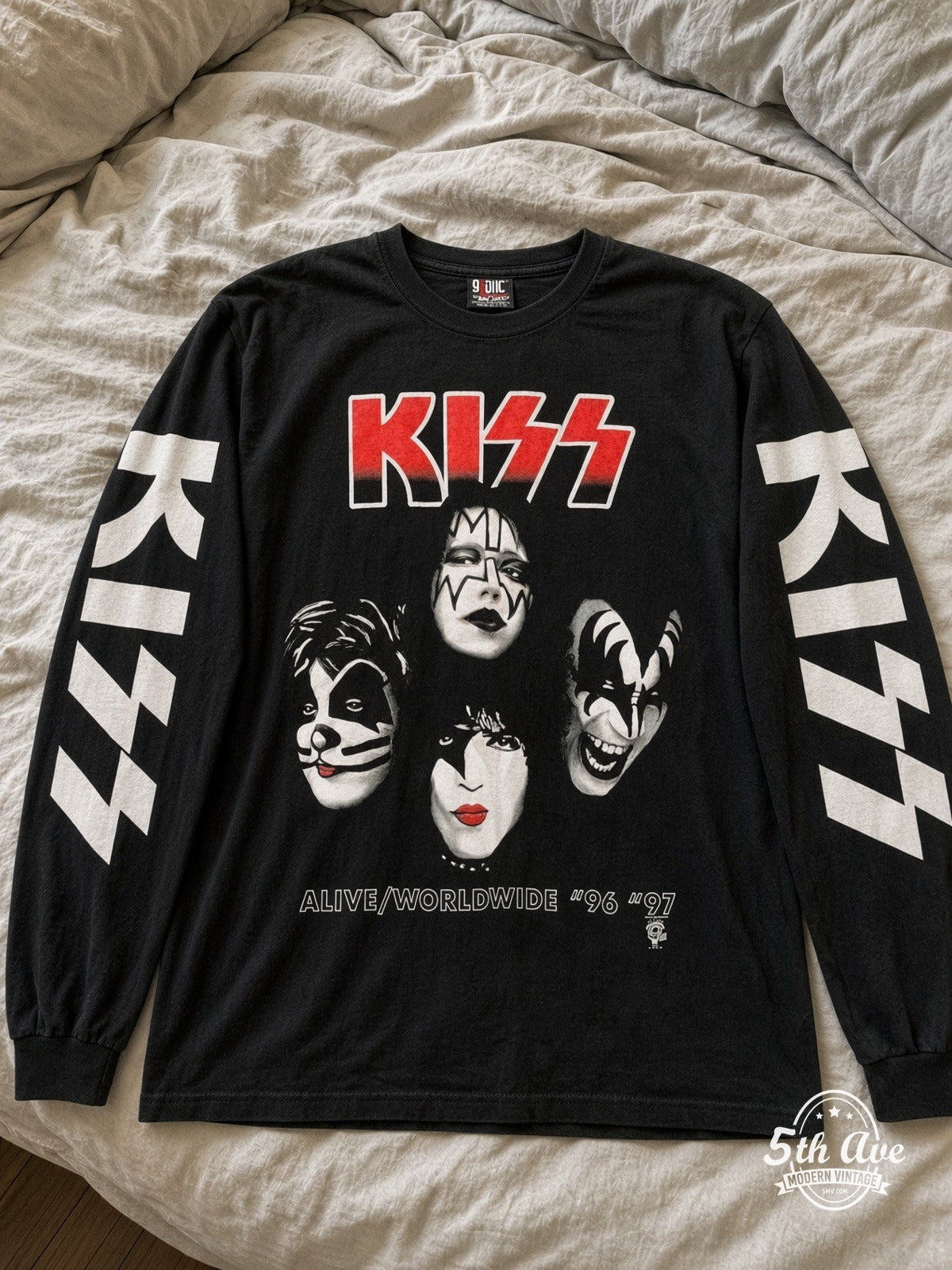 ETS LS 55 KISS Alive Worldwide 96-97 long sleeve vintage tee laid on a bed