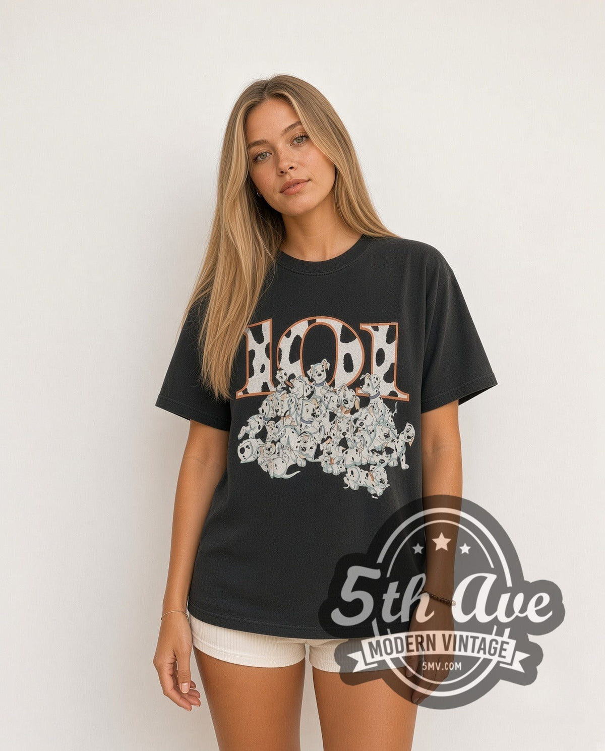 Model wearing the 101 Dalmatians 101 Puppies Pile vintage cartoon tee in black