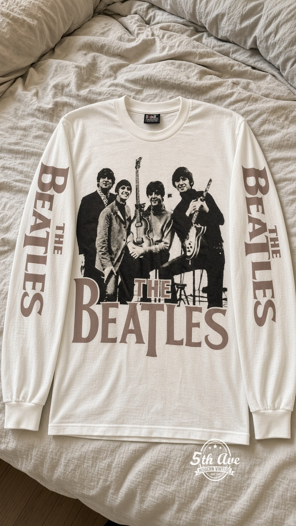 ETS LS 62 The Beatles Band Photo long sleeve vintage tee laid on a bed