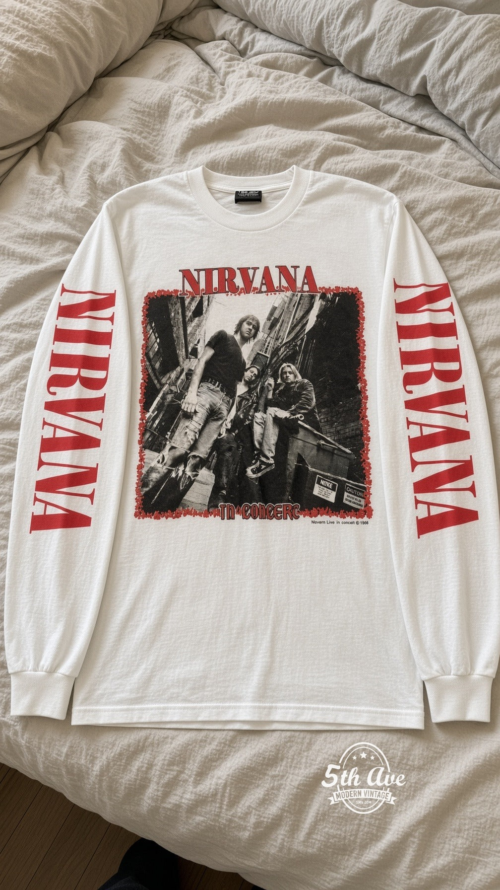 ETS LS 64 Nirvana In Concert long sleeve vintage tee laid on a bed