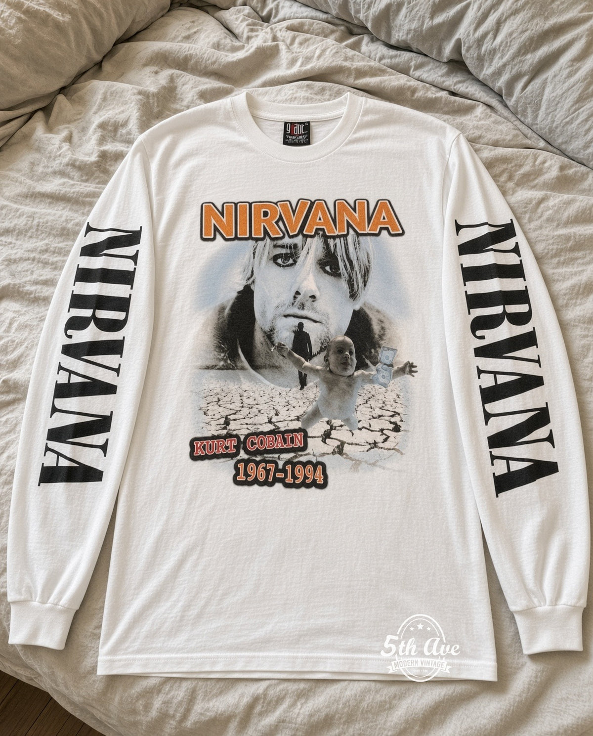 ETS LS 73 Nirvana Kurt Cobain Cracked Earth long sleeve vintage tee laid on a bed