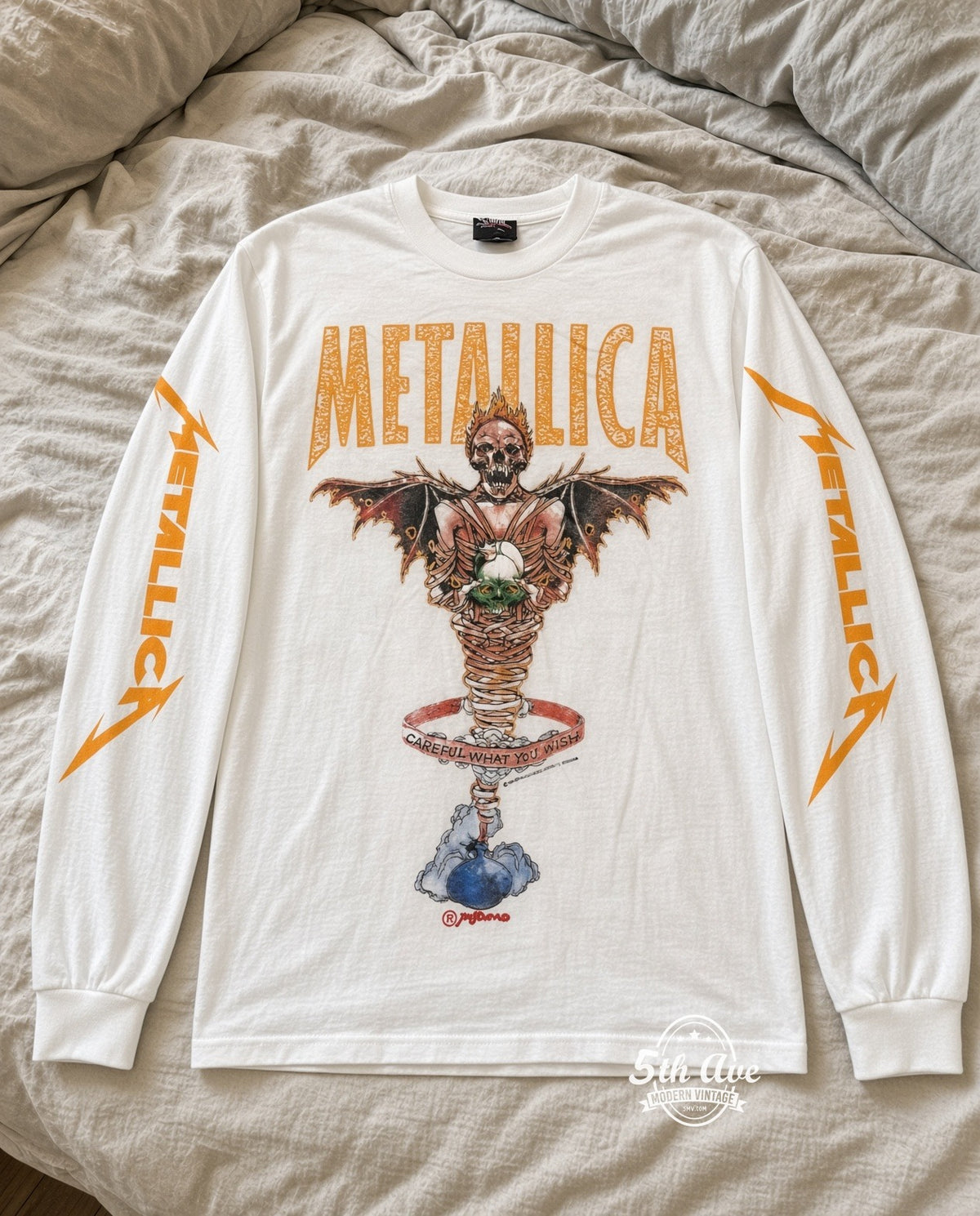 ETS LS 75 Metallica Careful What You Wish long sleeve vintage tee laid on a bed