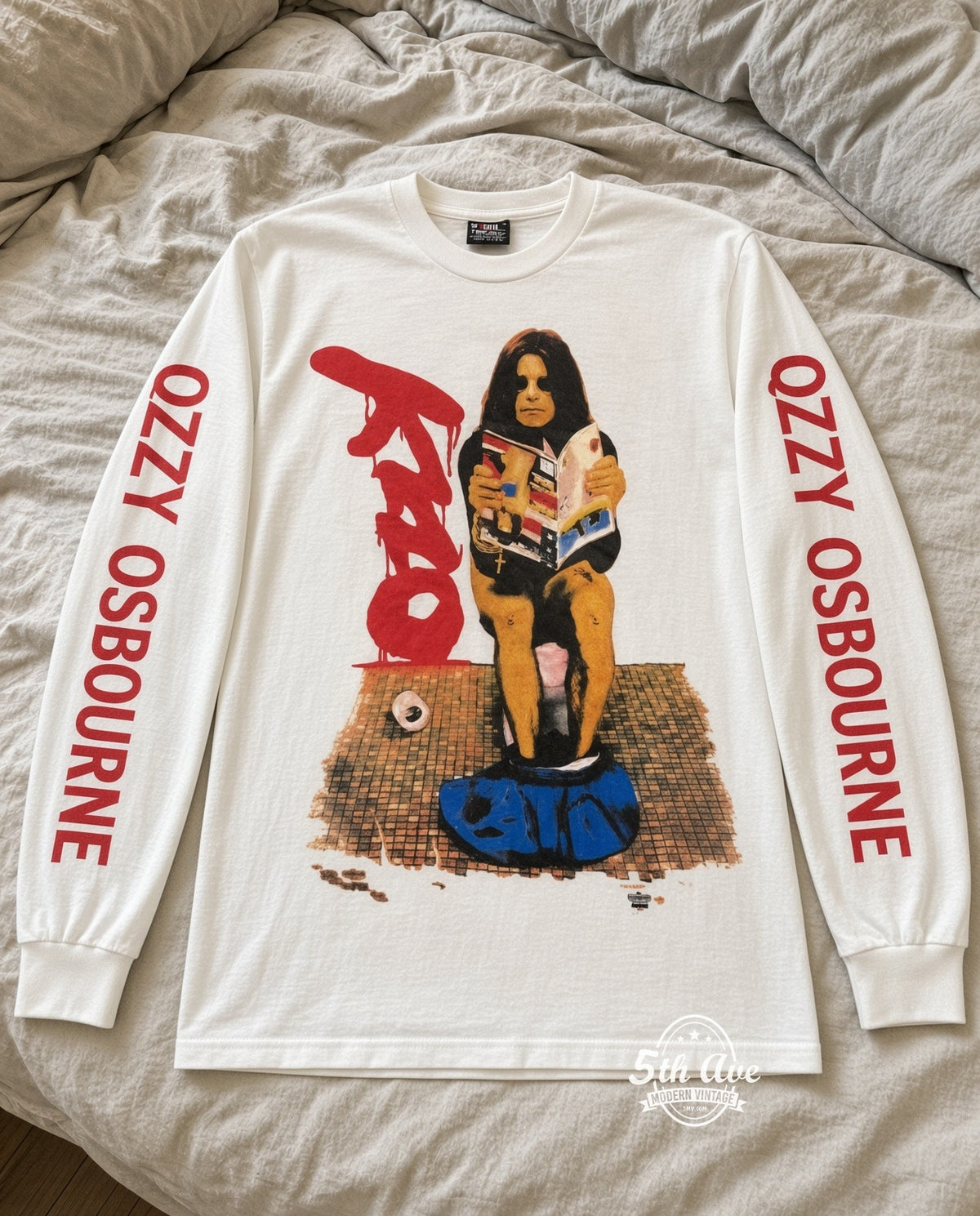 ETS LS 77 Ozzy Osbourne On the Toilet long sleeve vintage tee laid on a bed