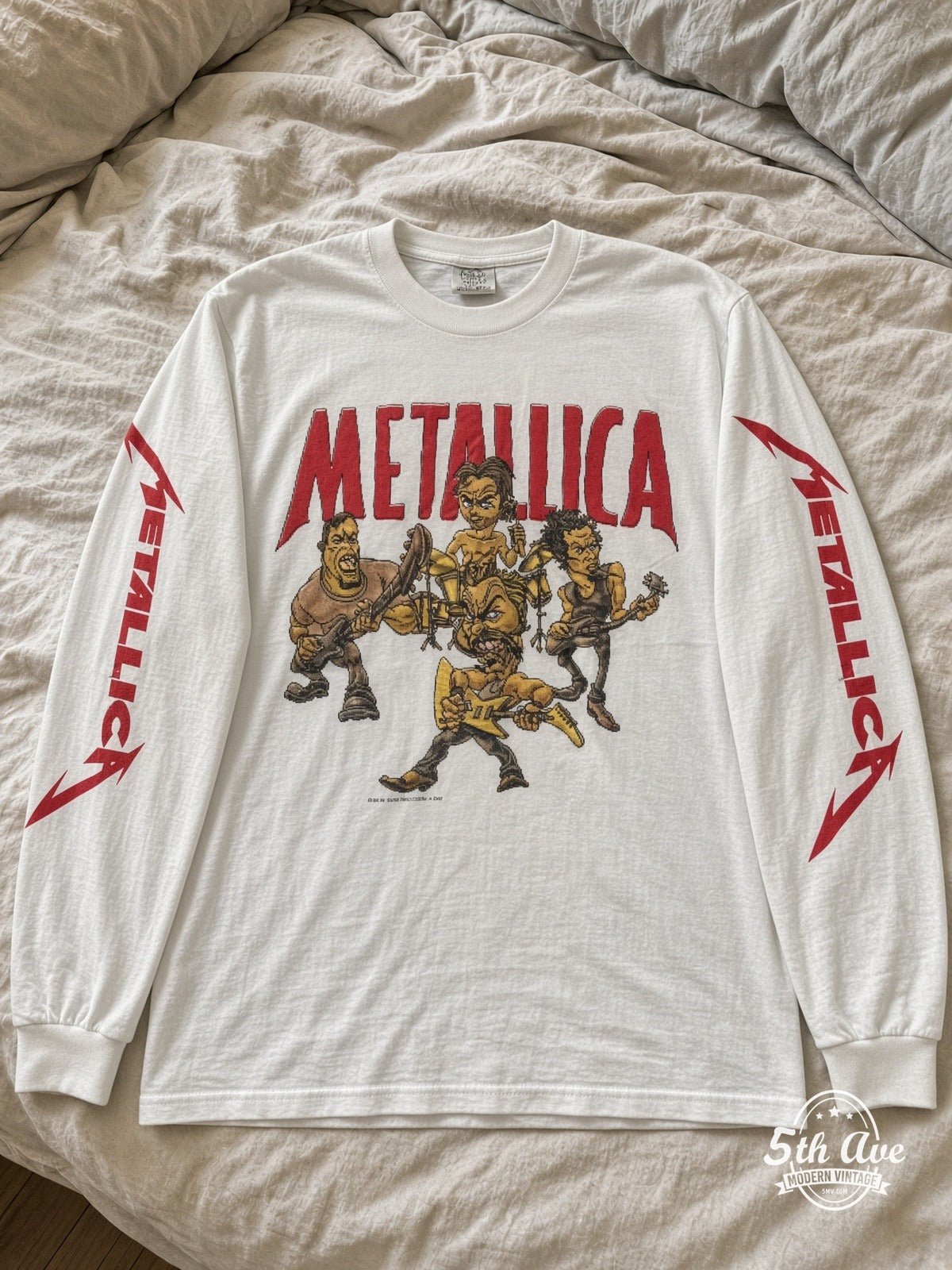 ETS LS 81 Metallica Cartoon Band long sleeve vintage tee laid on a bed