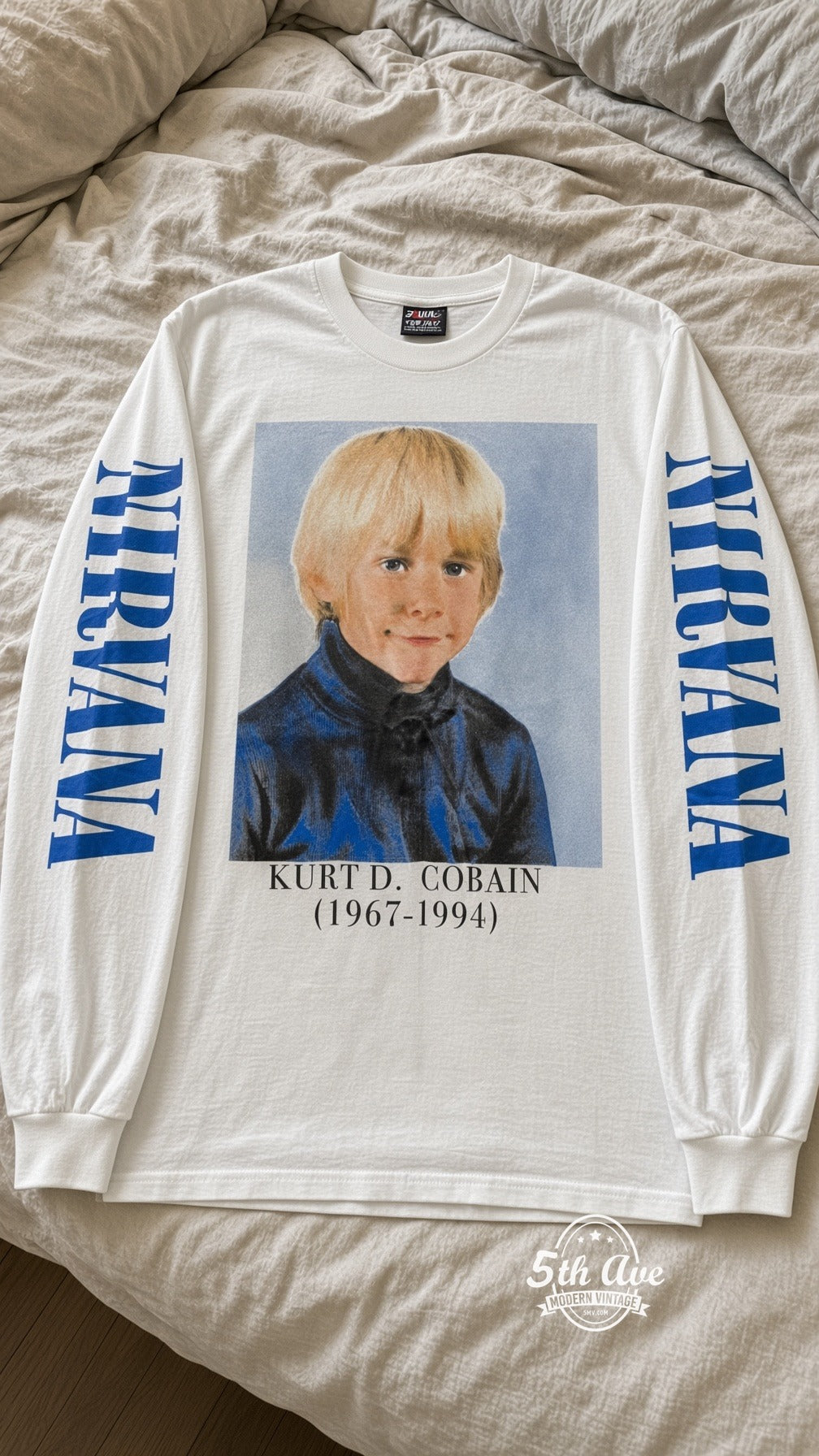 ETS LS 83 Nirvana Young Kurt Cobain long sleeve vintage tee laid on a bed