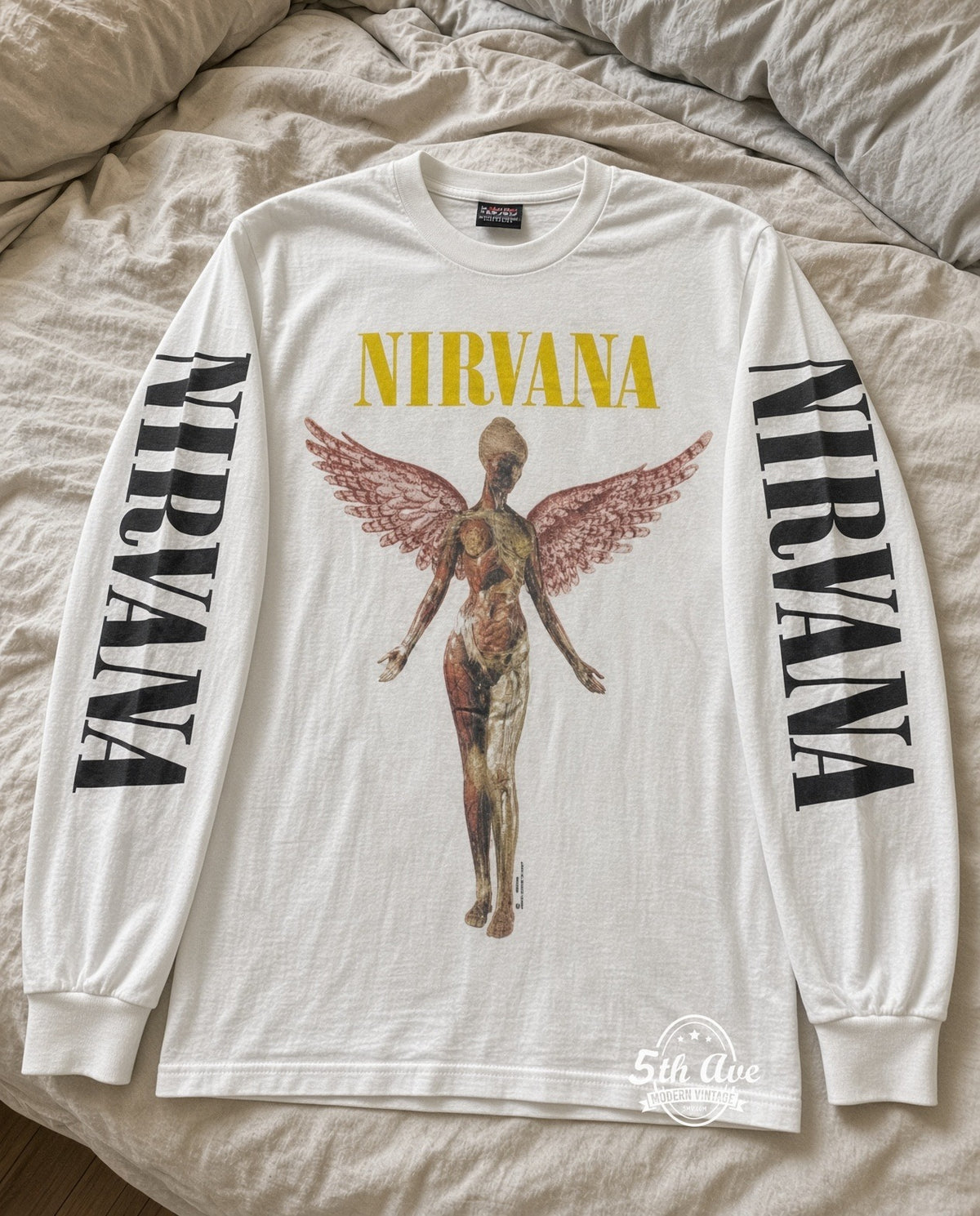 ETS LS 85 Nirvana In Utero Angel long sleeve vintage tee laid on a bed
