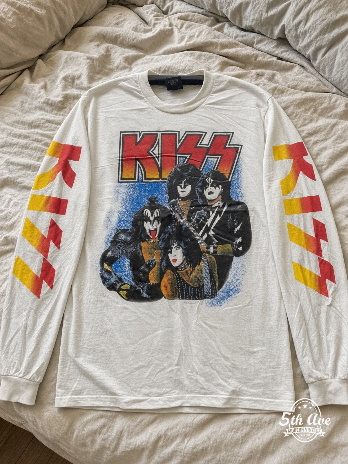 ETS LS 86 KISS Band Portrait long sleeve vintage tee laid on a bed