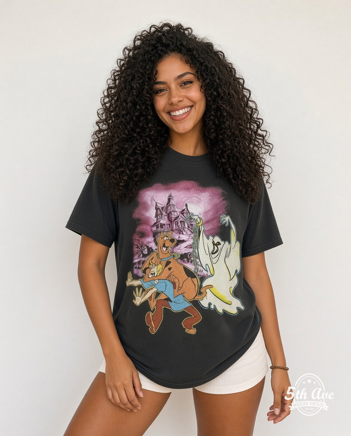 Model wearing the Scooby-Doo Haunted Mansion graphic tee in black