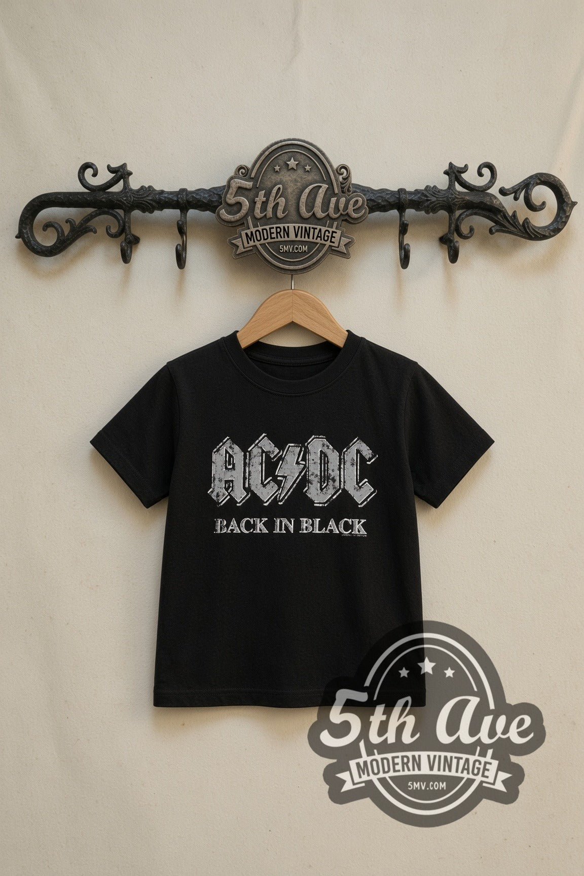 AC/DC Back in Black kids band tee in black, front view on a display rack