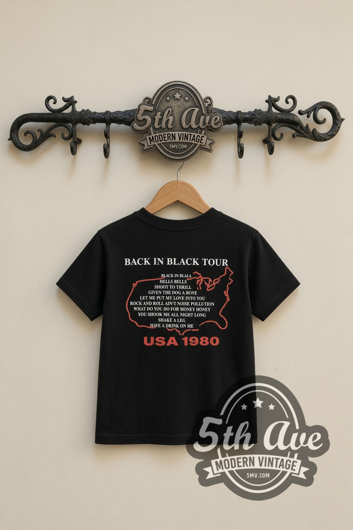 AC/DC Back in Black kids band tee in black, back view on a display rack