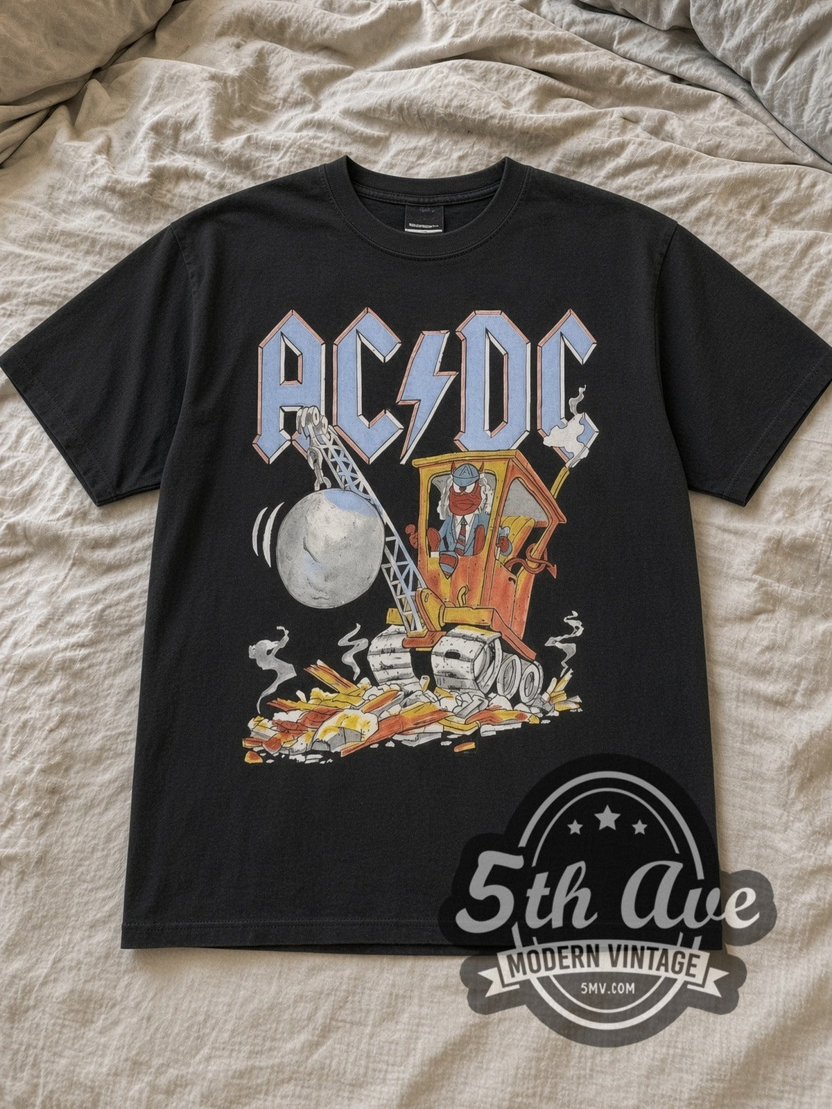 Black AC/DC Ballbreaker Vintage Band T-Shirt laid flat on a linen bed