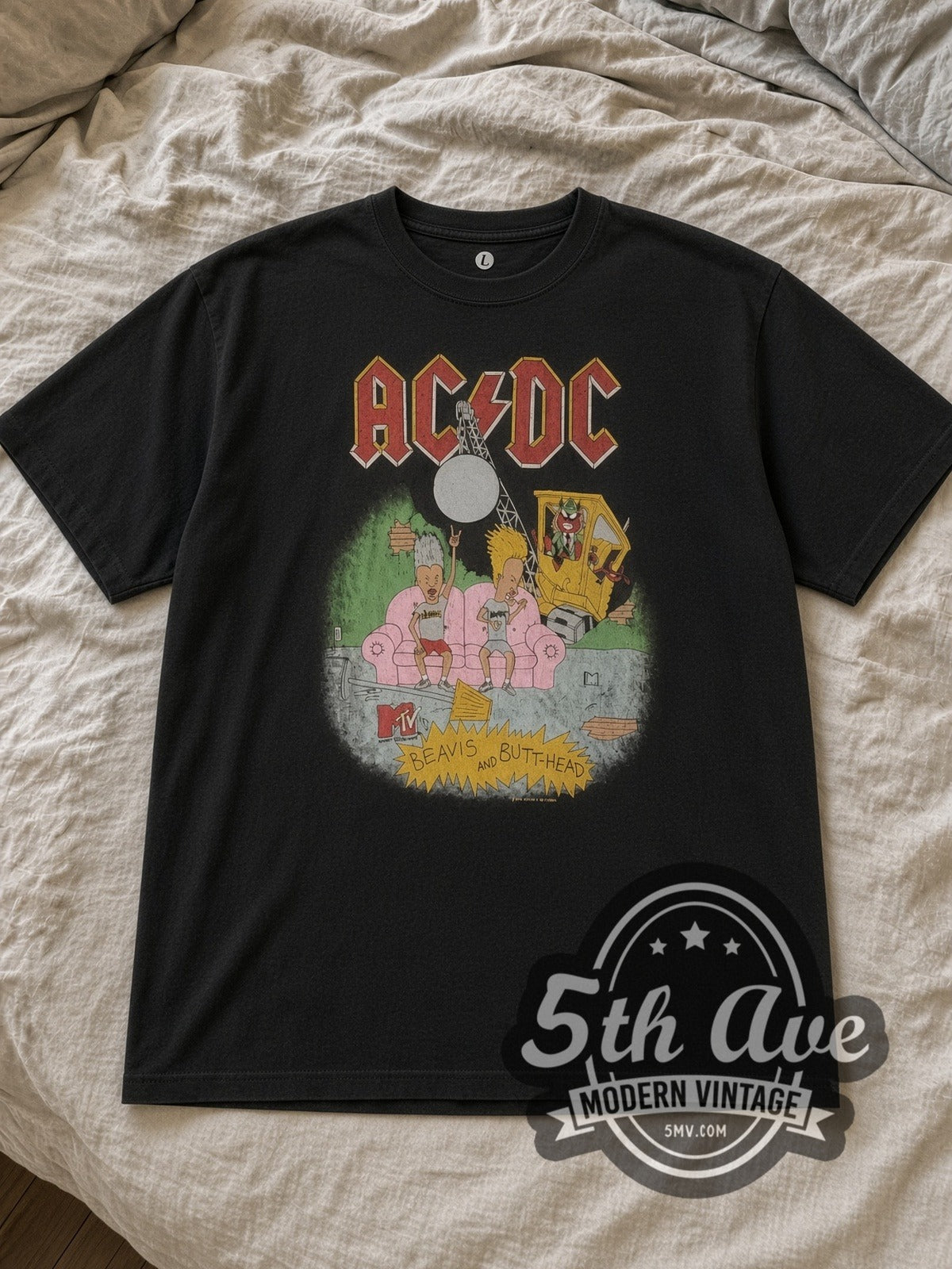 Black AC/DC x Beavis and Butt Head Pink Couch MTV Washed Black Vintage Band T-Shirt laid flat on a linen bed
