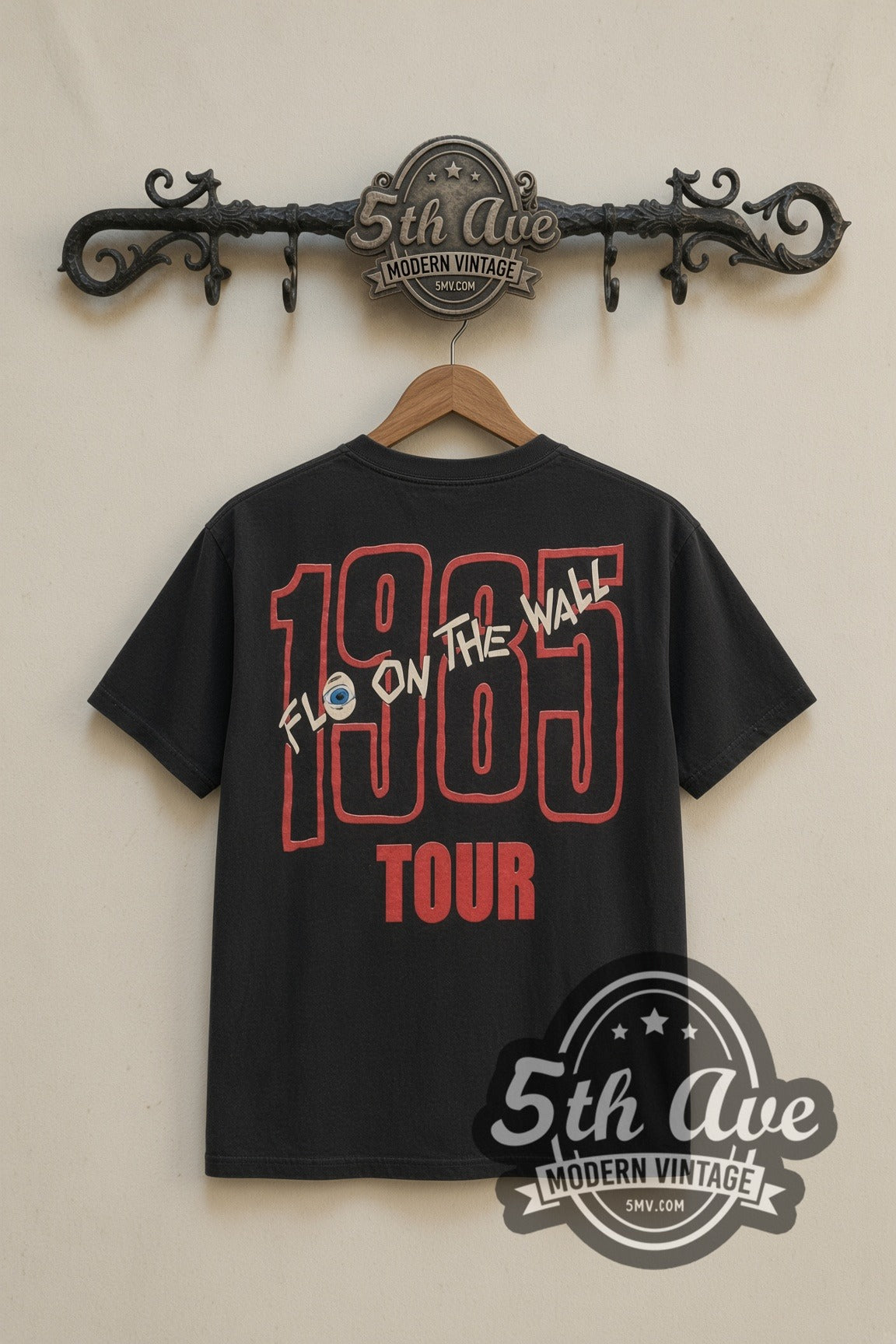 AC/DC Fly on the Wall 1985 Tour Eye band t-shirt in black, back view on a display rack