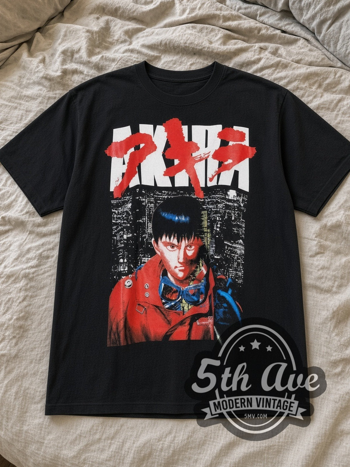 Black Akira Kaneda Neo Tokyo Logo Vintage Anime T-Shirt laid flat on a linen bed