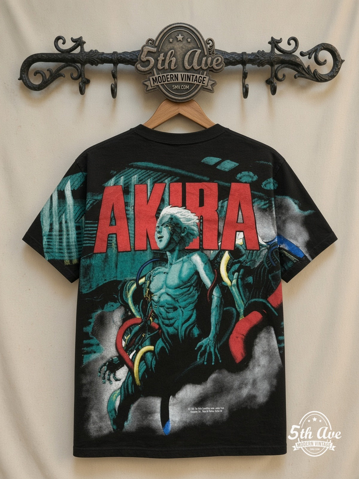 Akira Teal Character all over print vintage tee back on cream 5th Ave rack