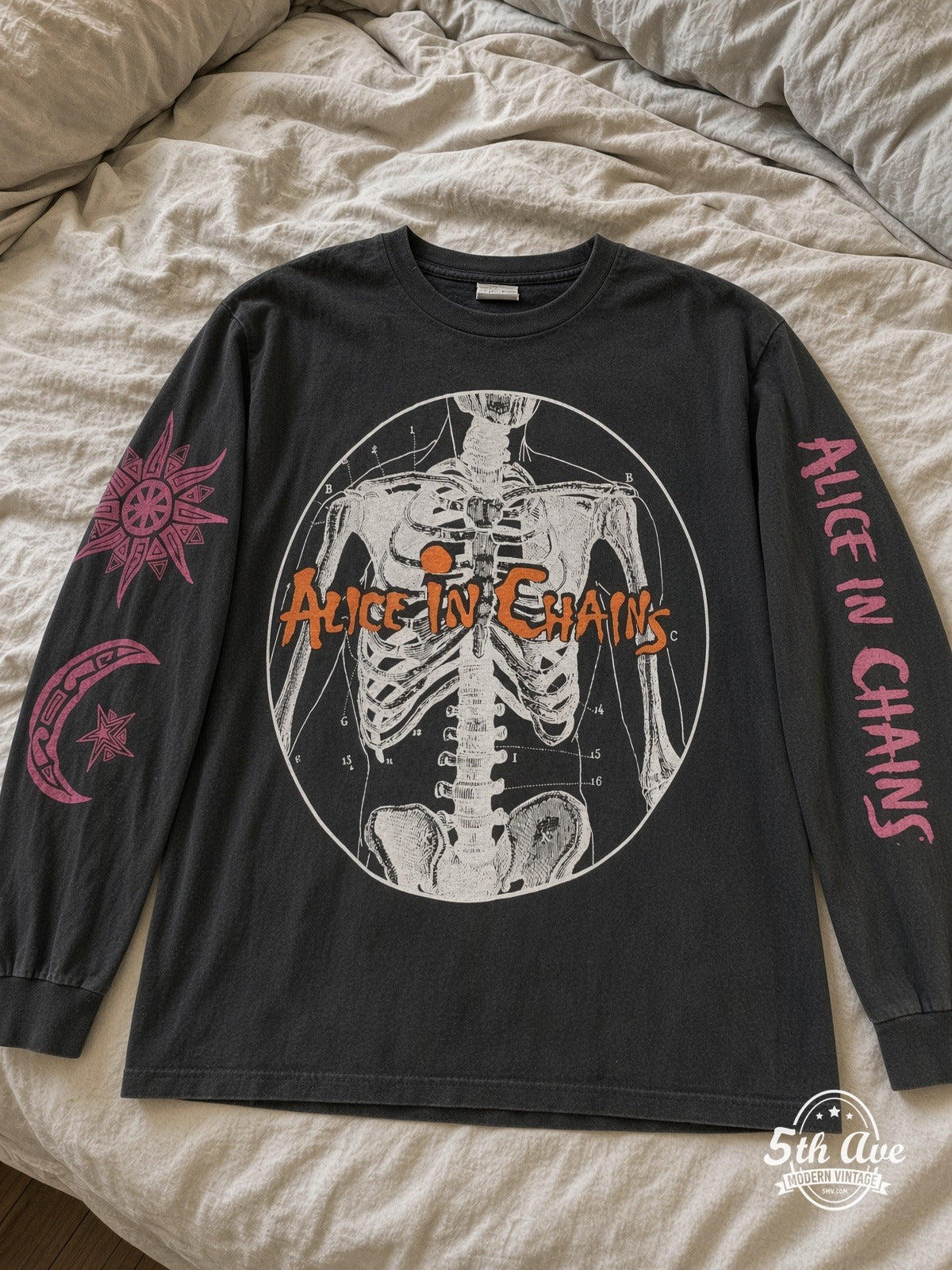 Alice in Chains Skeleton Anatomy vintage tee laid on bed