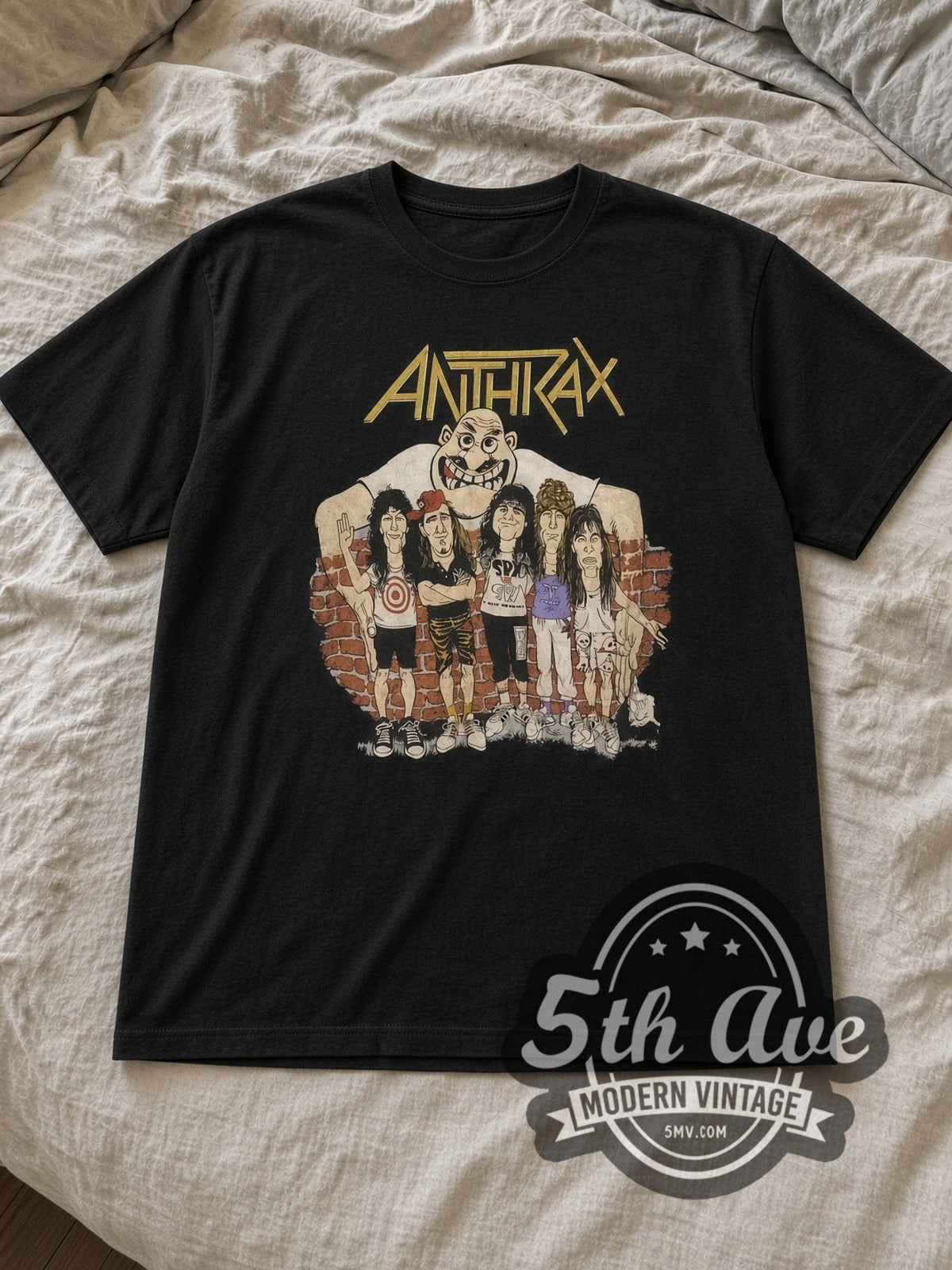Black Anthrax Band Cartoon Vintage Band T-Shirt laid flat on a linen bed