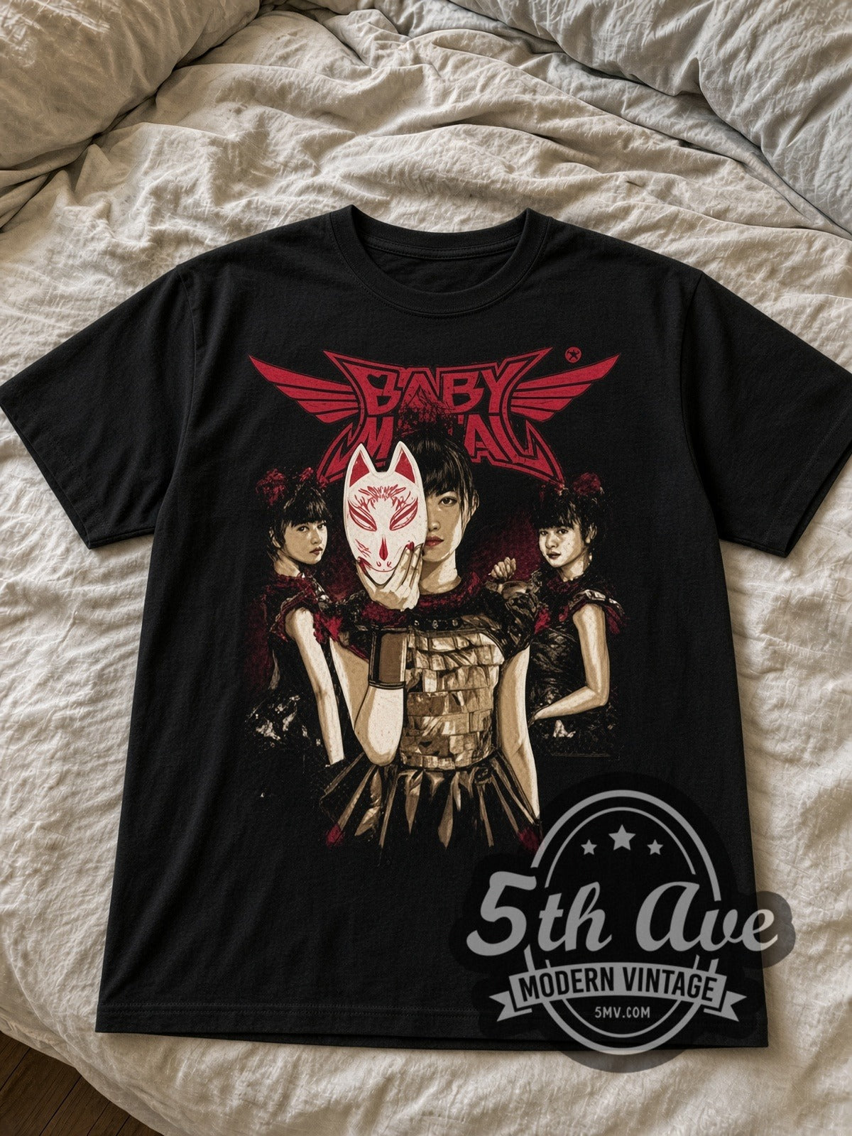 Babymetal Fox Mask Trio black graphic tee laid flat on linen bed