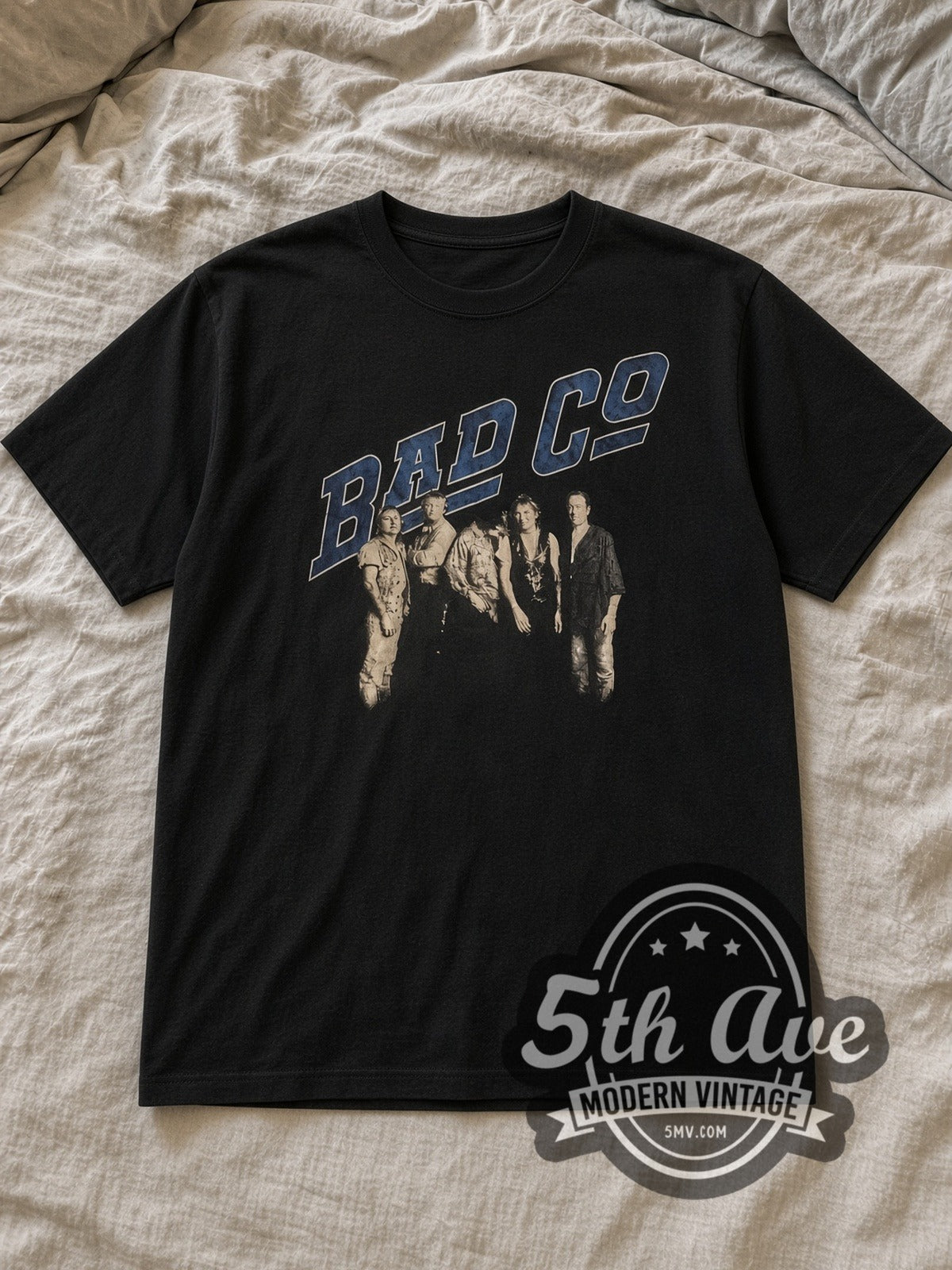 Black Bad Company Blue Logo Band Photo Vintage Band T-Shirt laid flat on a linen bed