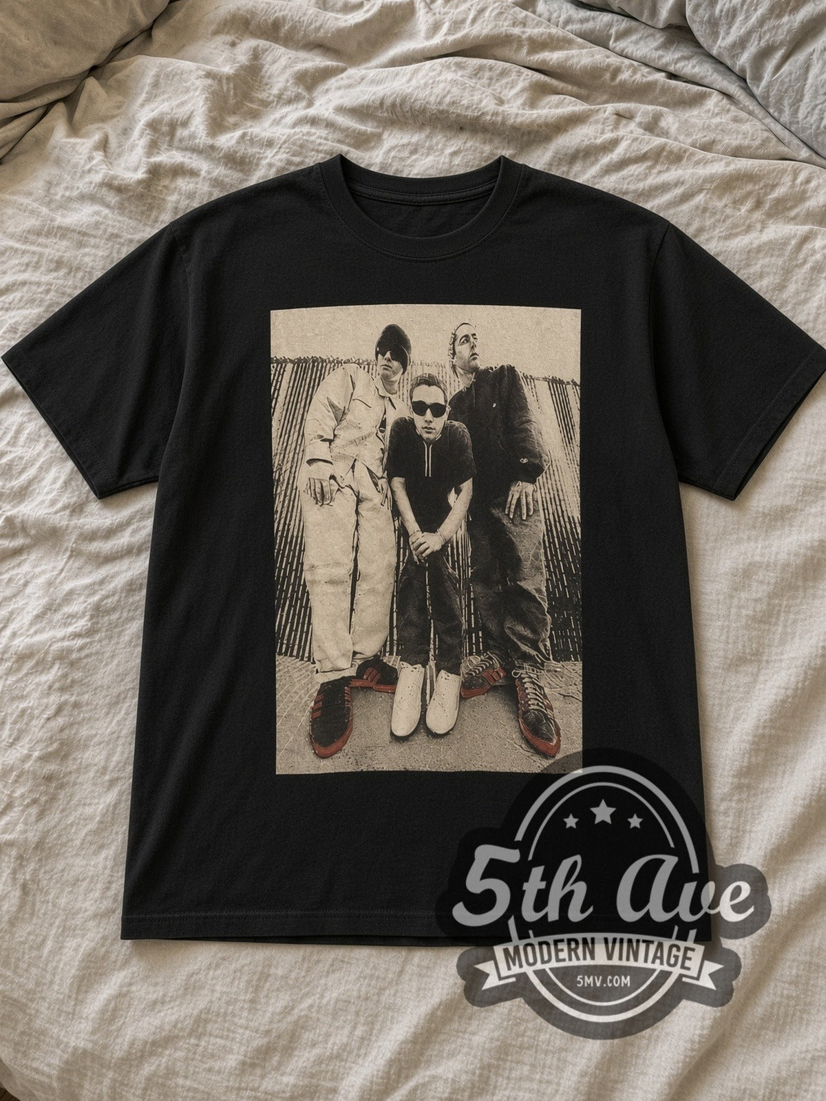 Black Beastie Boys Vintage Rap Tee laid flat on a linen bed