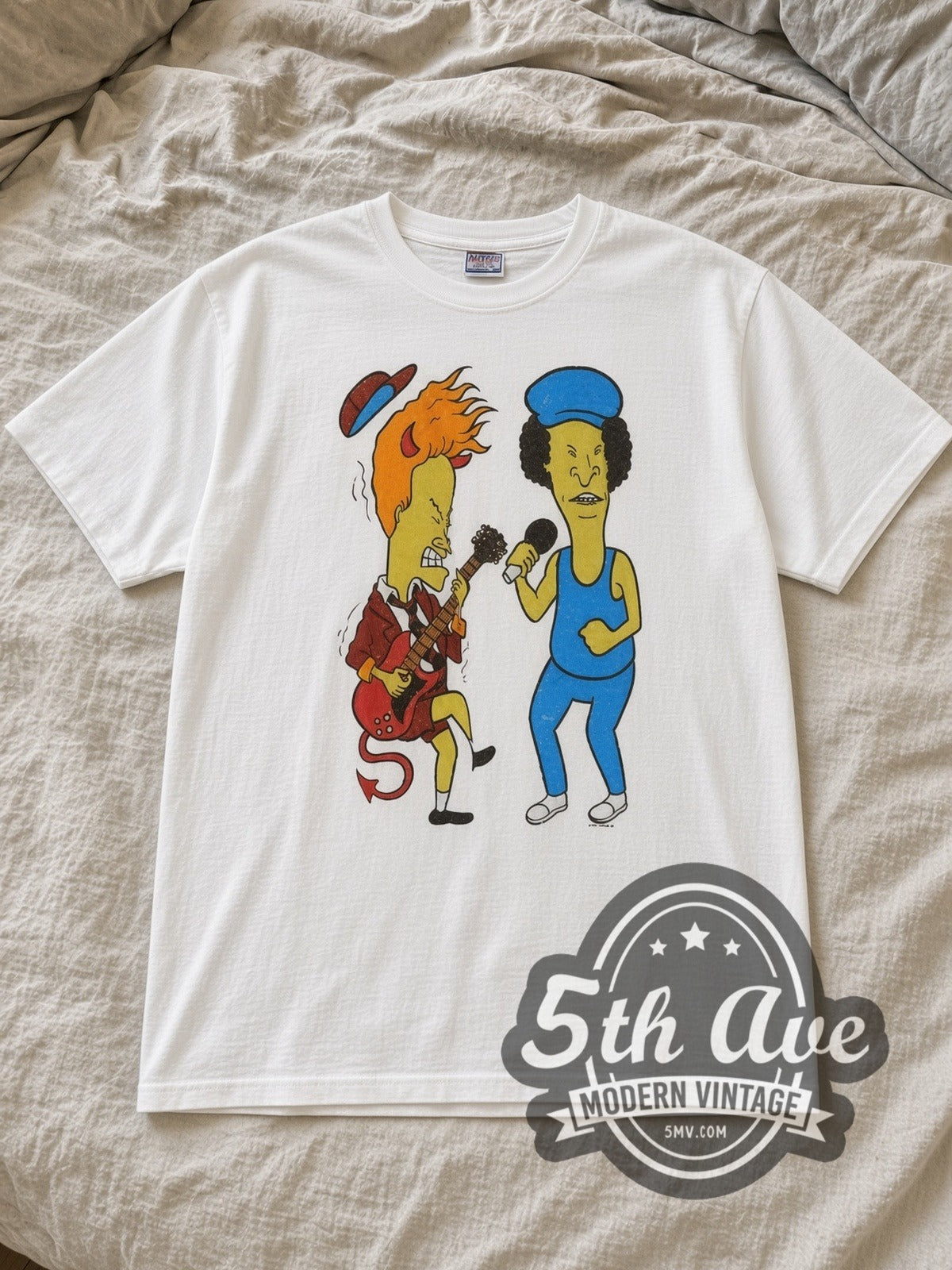 White AC/DC / Beavis and Butt Head Cartoon Crossover Vintage Cartoon T-Shirt laid flat on a linen bed
