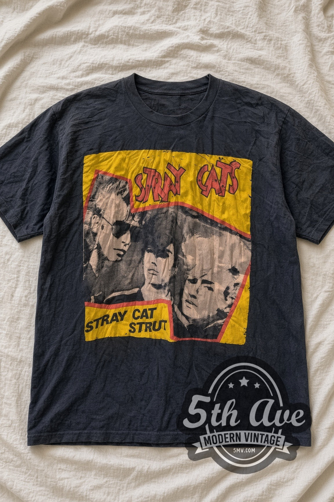 Stray Cats Stray Cat Strut Yellow Band Photo vintage band t-shirt, laid flat on a bed
