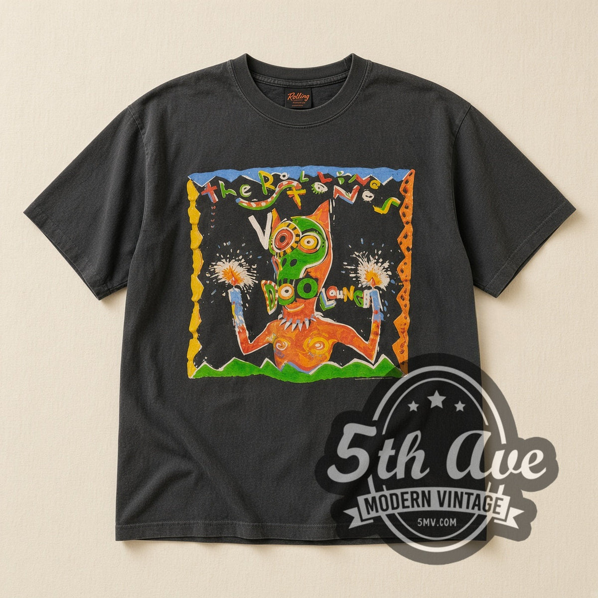 The Rolling Stones Voodoo Lounge World Tour 1994 vintage band t-shirt in black laid flat on a bed, front artwork