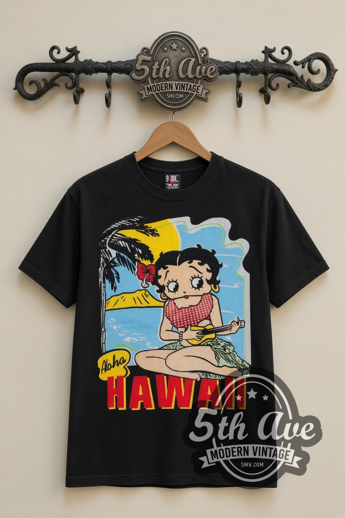 Betty Boop Aloha Hawaii Polynesian Princess cartoon tee in black, front view on a display rack