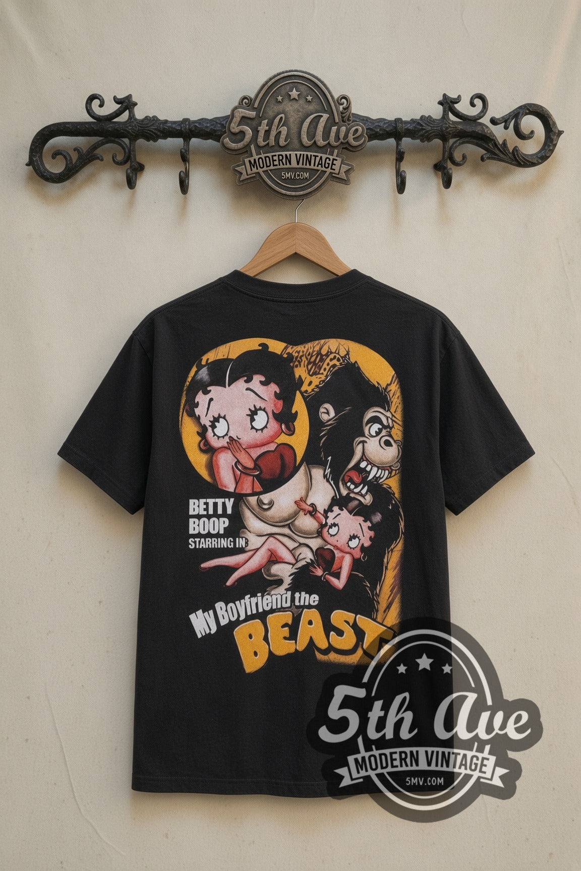 Betty Boop Betty and the Beast cartoon tee in black, back view on a display rack