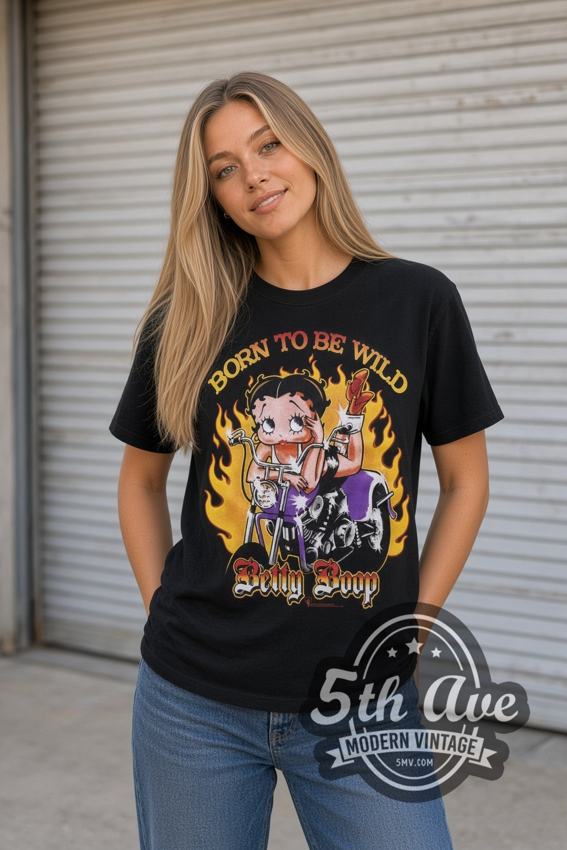 Model wearing the Betty Boop Born to Be Wild Biker cartoon tee in black