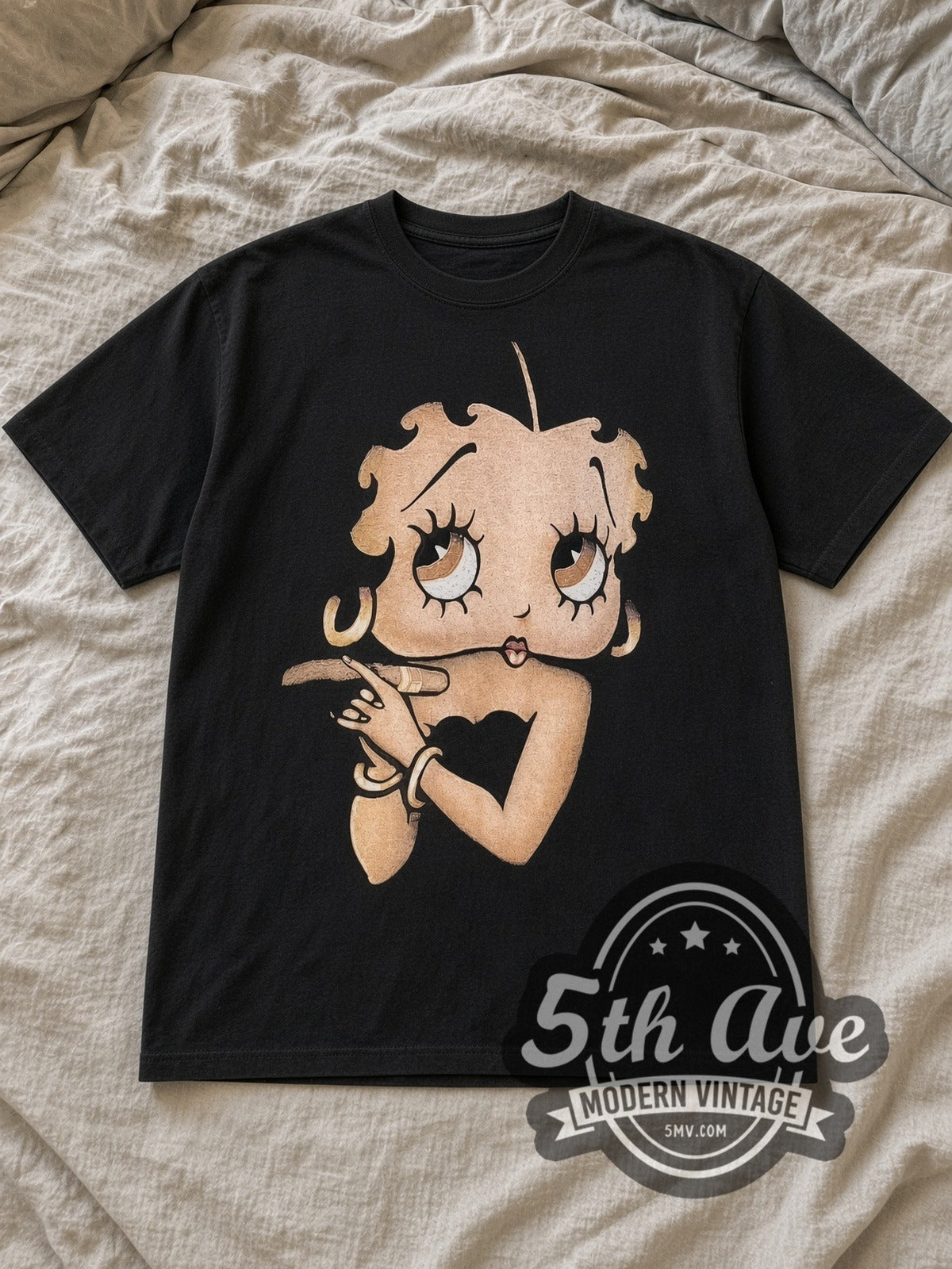 Black Betty Boop Hollyboop Vintage Cartoon T-Shirt laid flat on a linen bed