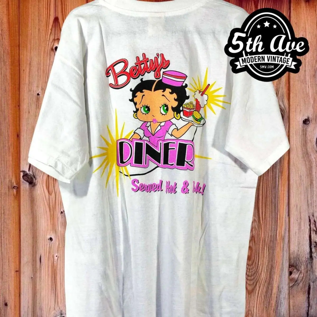 Betty Boop's Diner Served Hot & Fresh - AOP all over print New Vintage Animation T-Shirt vintage t-shirt laid on bed